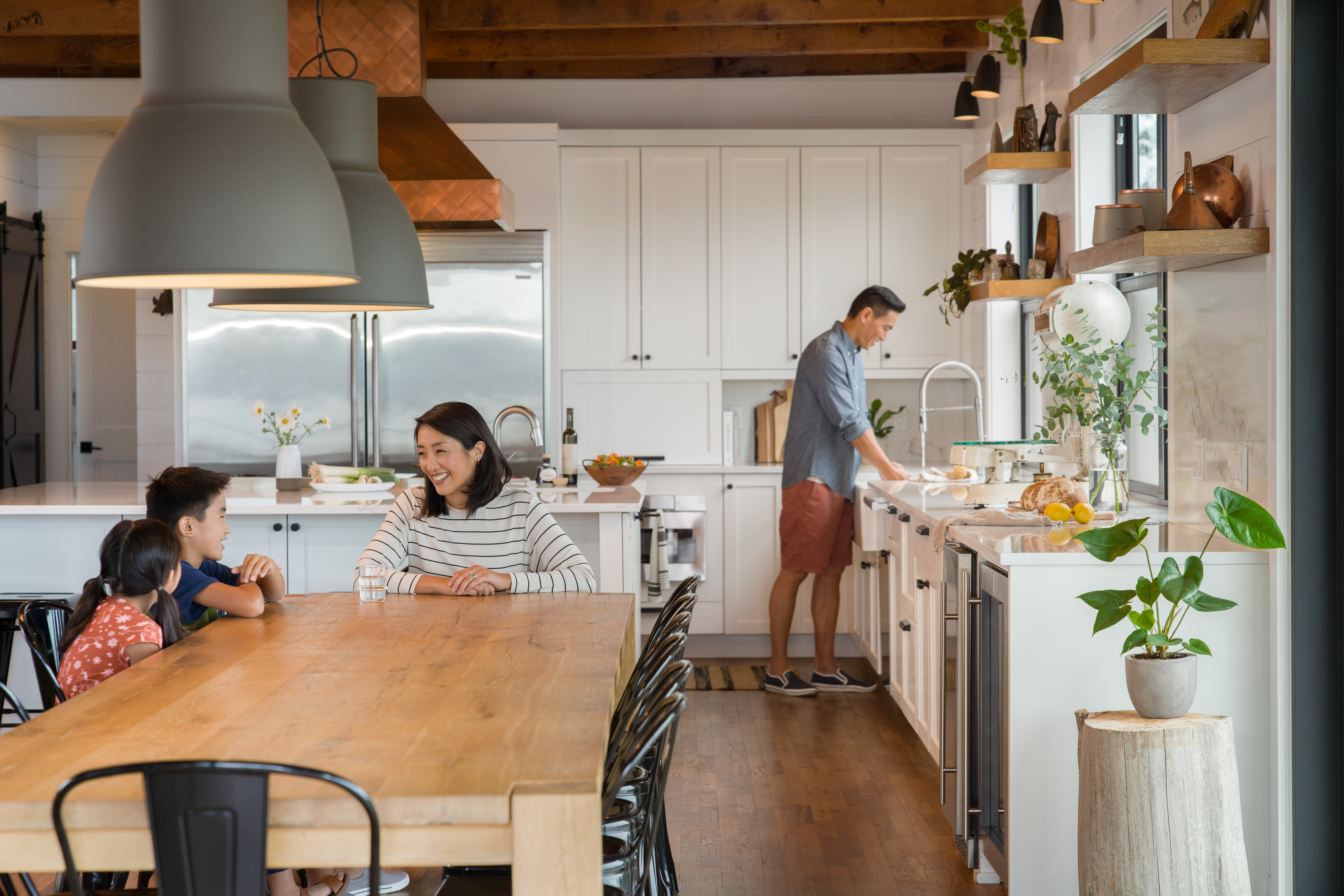 Family preparing dinner at a vacation rental.