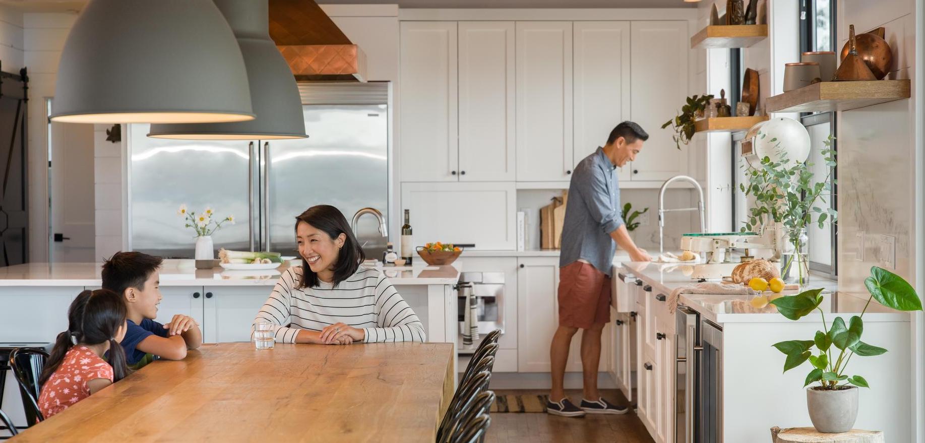 Image of family cooking and enjoying a meal.