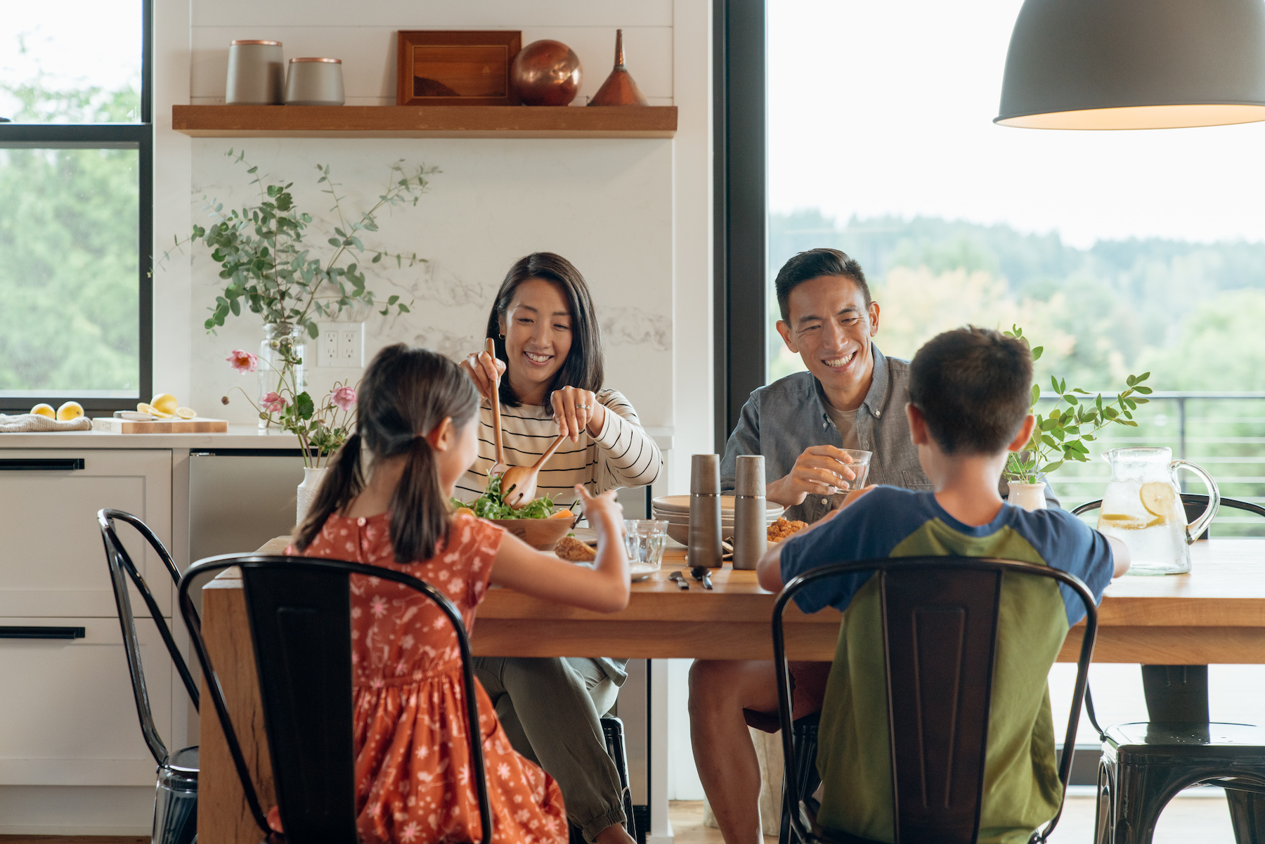 Family having dinner at a vacation rental.