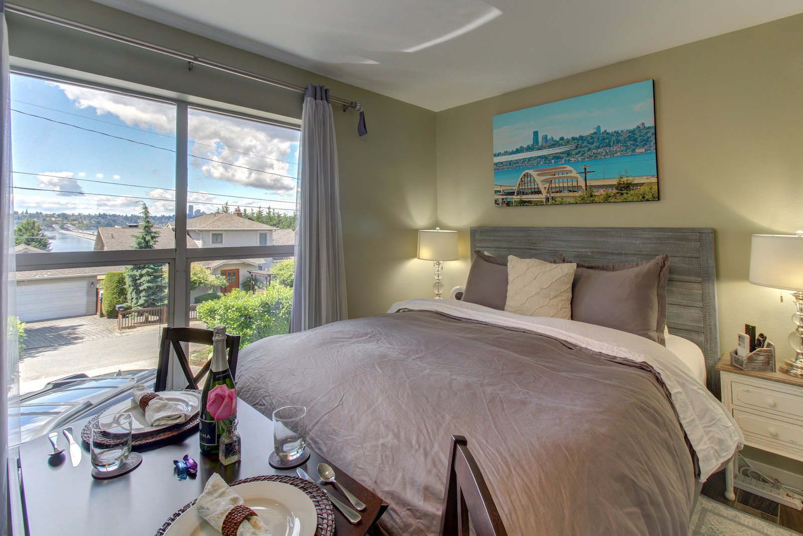 The bedroom of a vacation rental in Mercer Island, WA with morning dining.