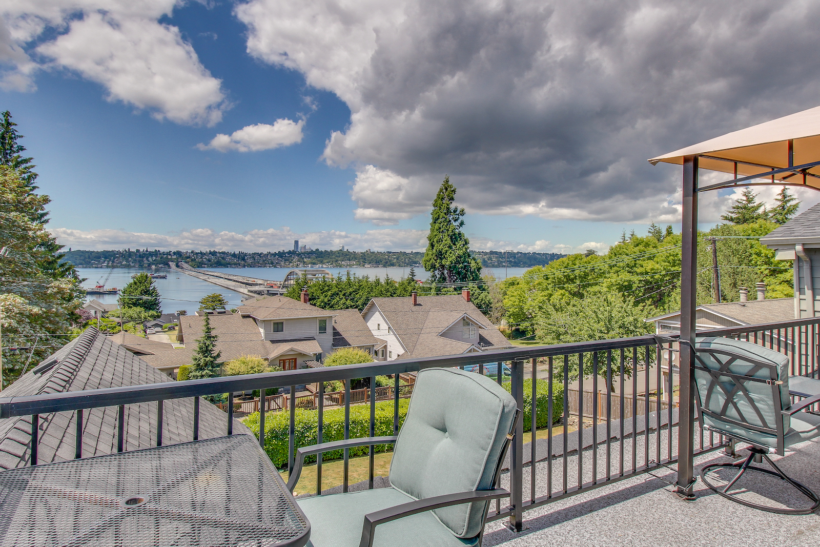 The back porch of a vacation rental in Mercer Island, WA overlooking the sound.