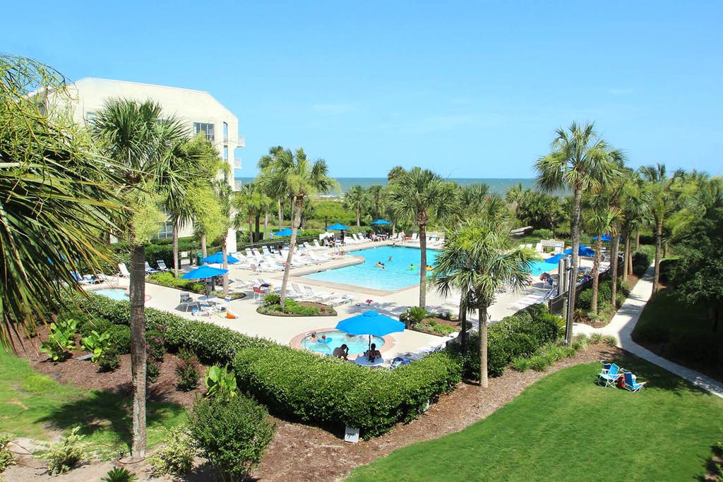 Large outdoor pool and hot tubs at a resort in Hilton Head, SC.