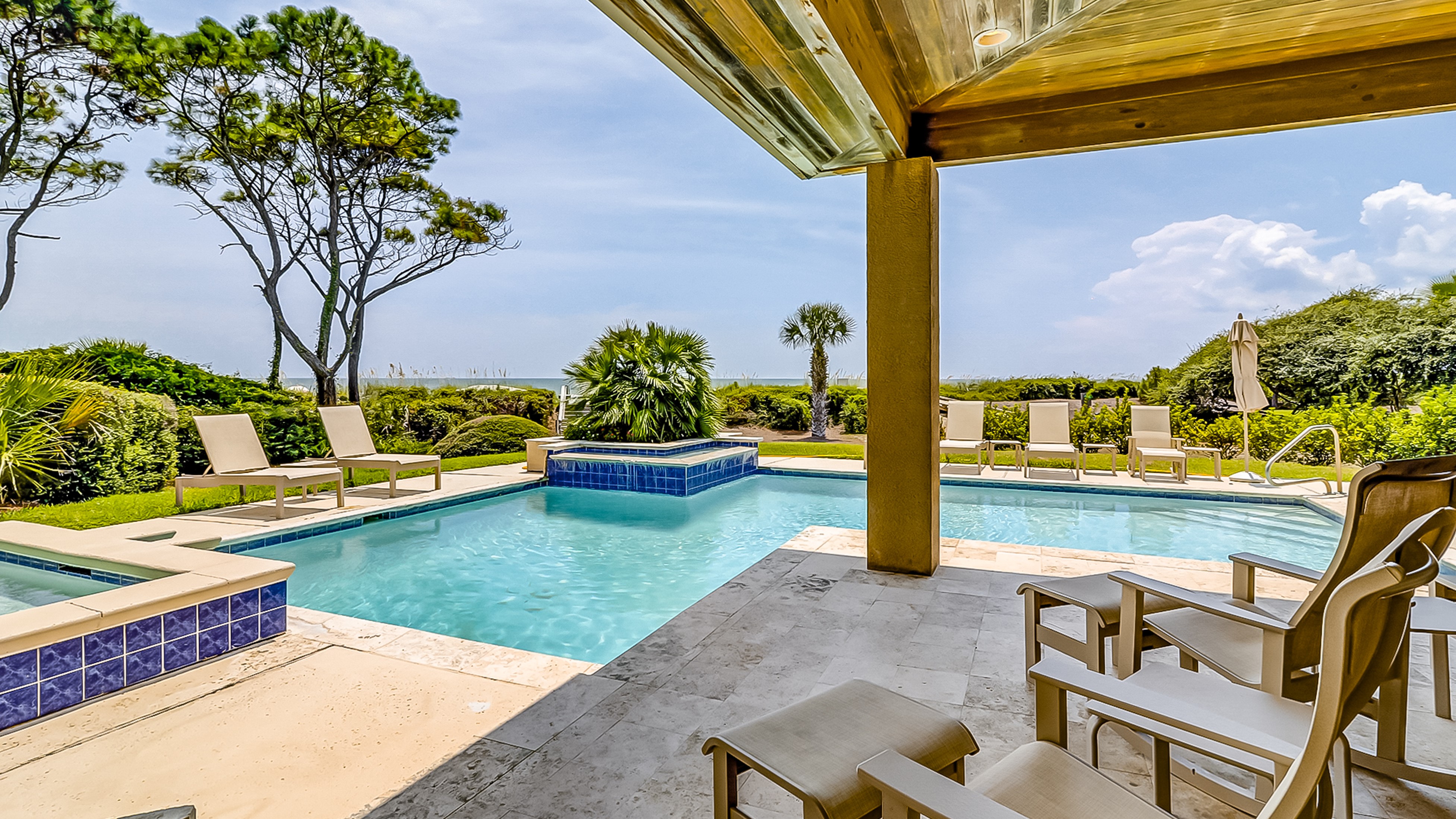 outdoor pool with beach and ocean views in hilton head