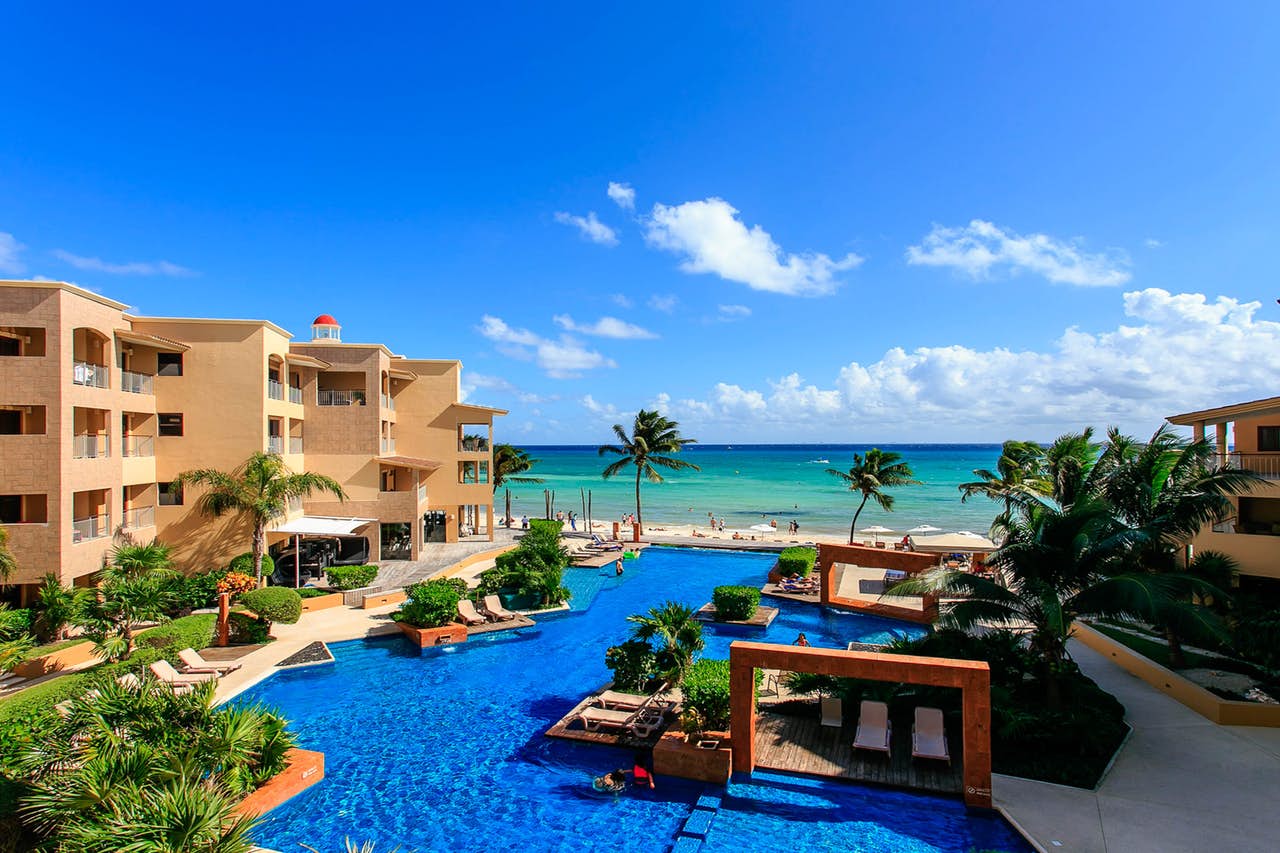 Deep blue colored pool at a resort with oceanfront view in Mexico