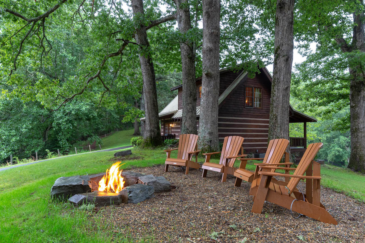The exterior firepit with chairs at a cabin rental in Whittier, NC.