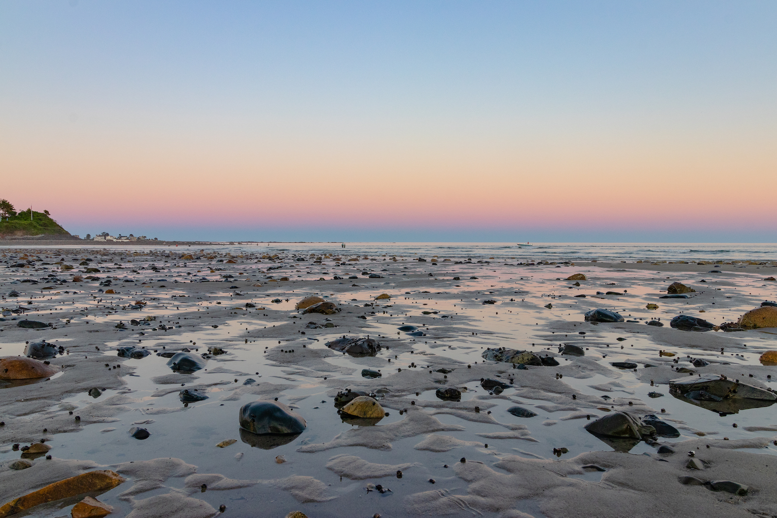 The receding tied during a sunset on Wells Beach.