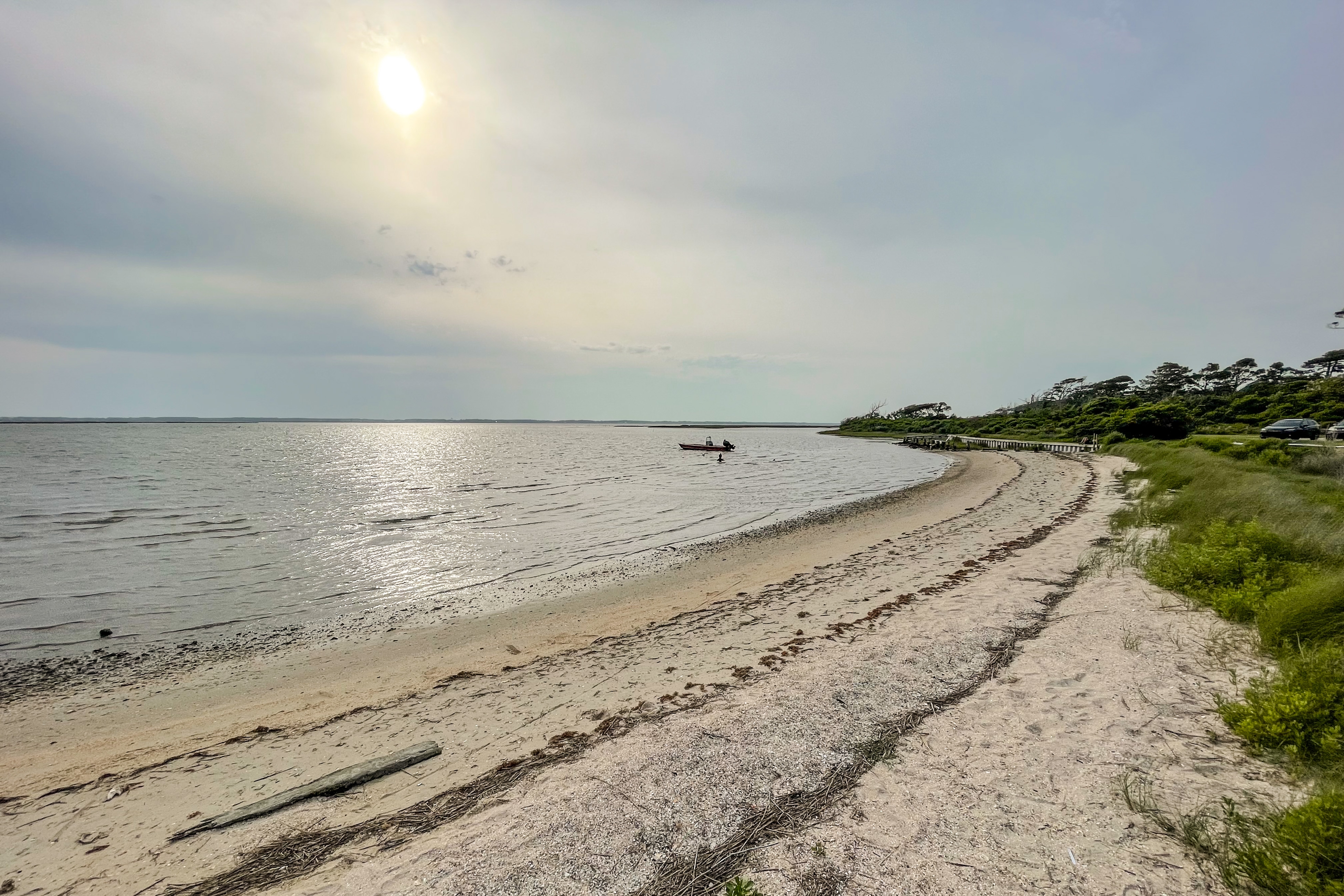 a sandy beach in Beaufort, NC, at sunset during the winter