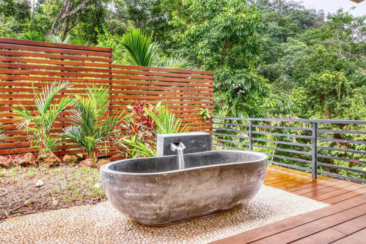 one-of-a-kind bathtub made from carved rock