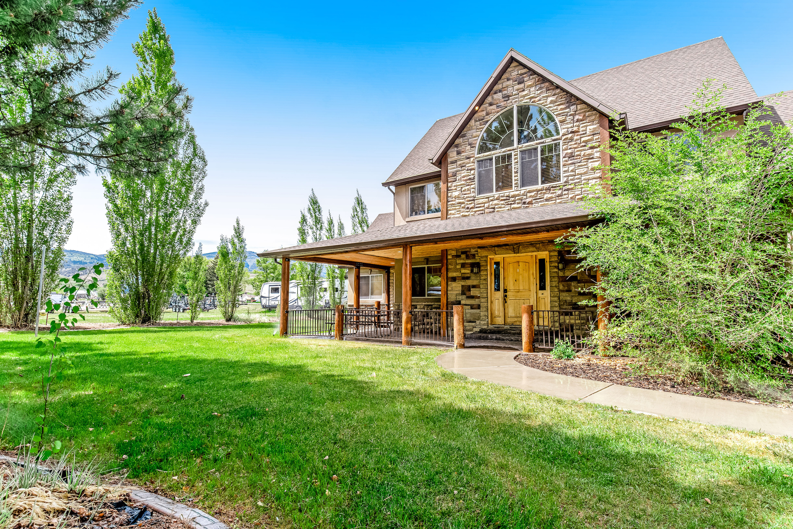 two story vacation home with covered patio in garden city, utah