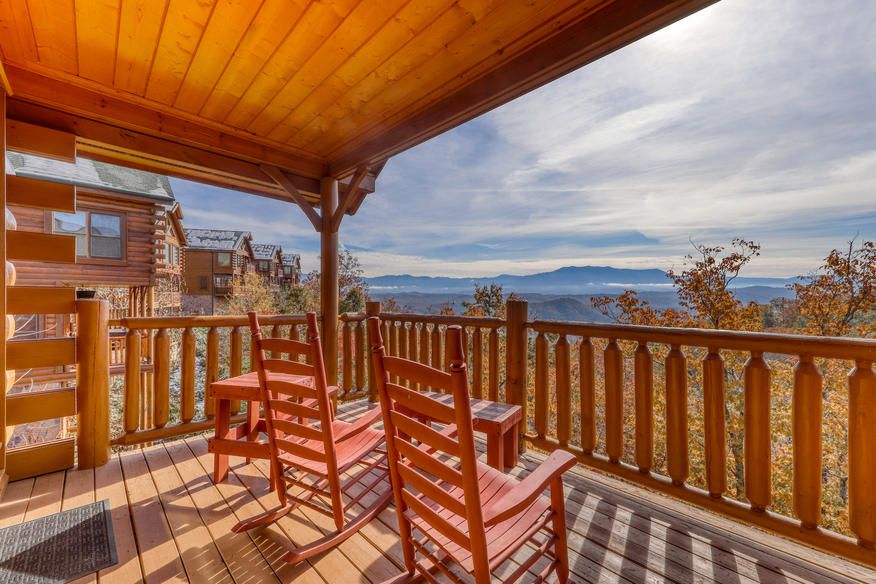 The deck of a vacation rental in the Smoky Mountains with a view.