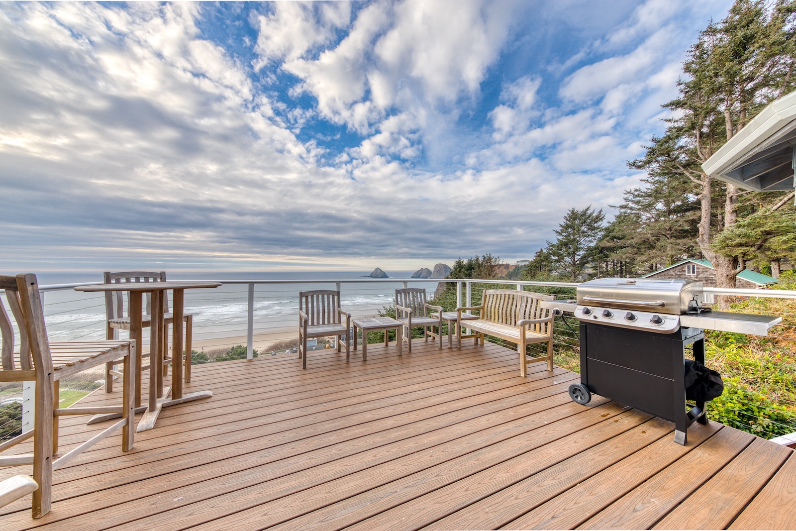 The deck of a vacation rental in Oceanside, OR overlooking the coast.