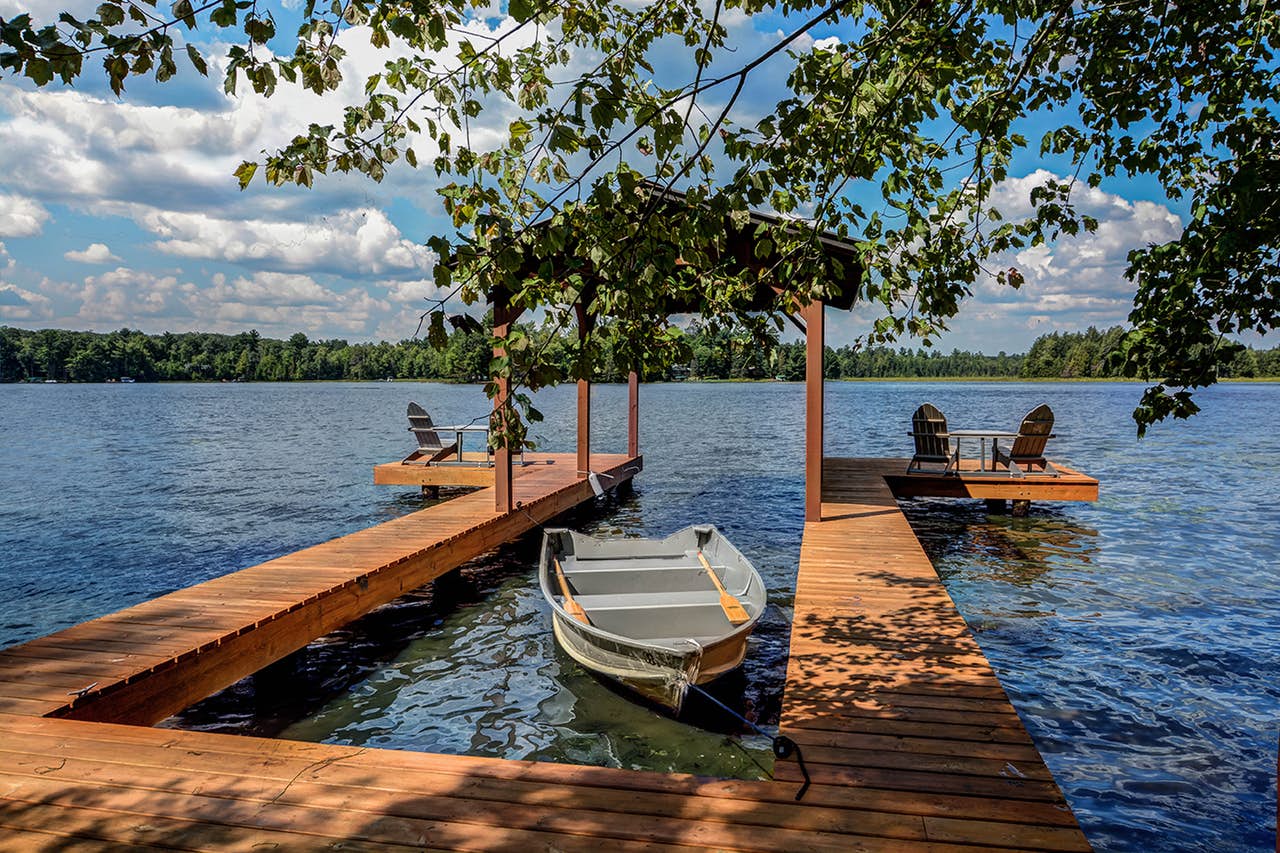 dock of wisconsin vacation rental with boat