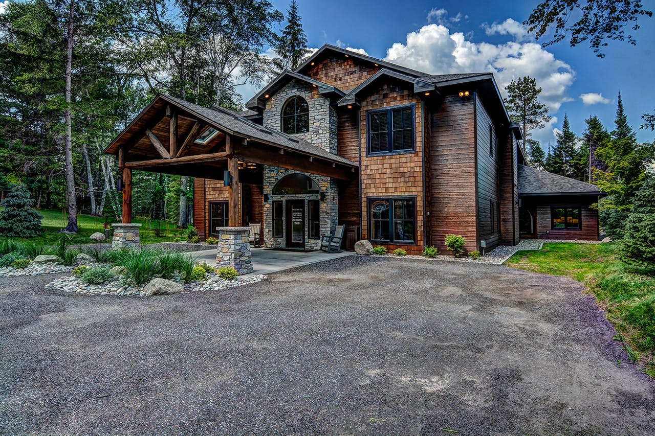 Lakefront lodge in Eagle River, WI with a private dock and game room