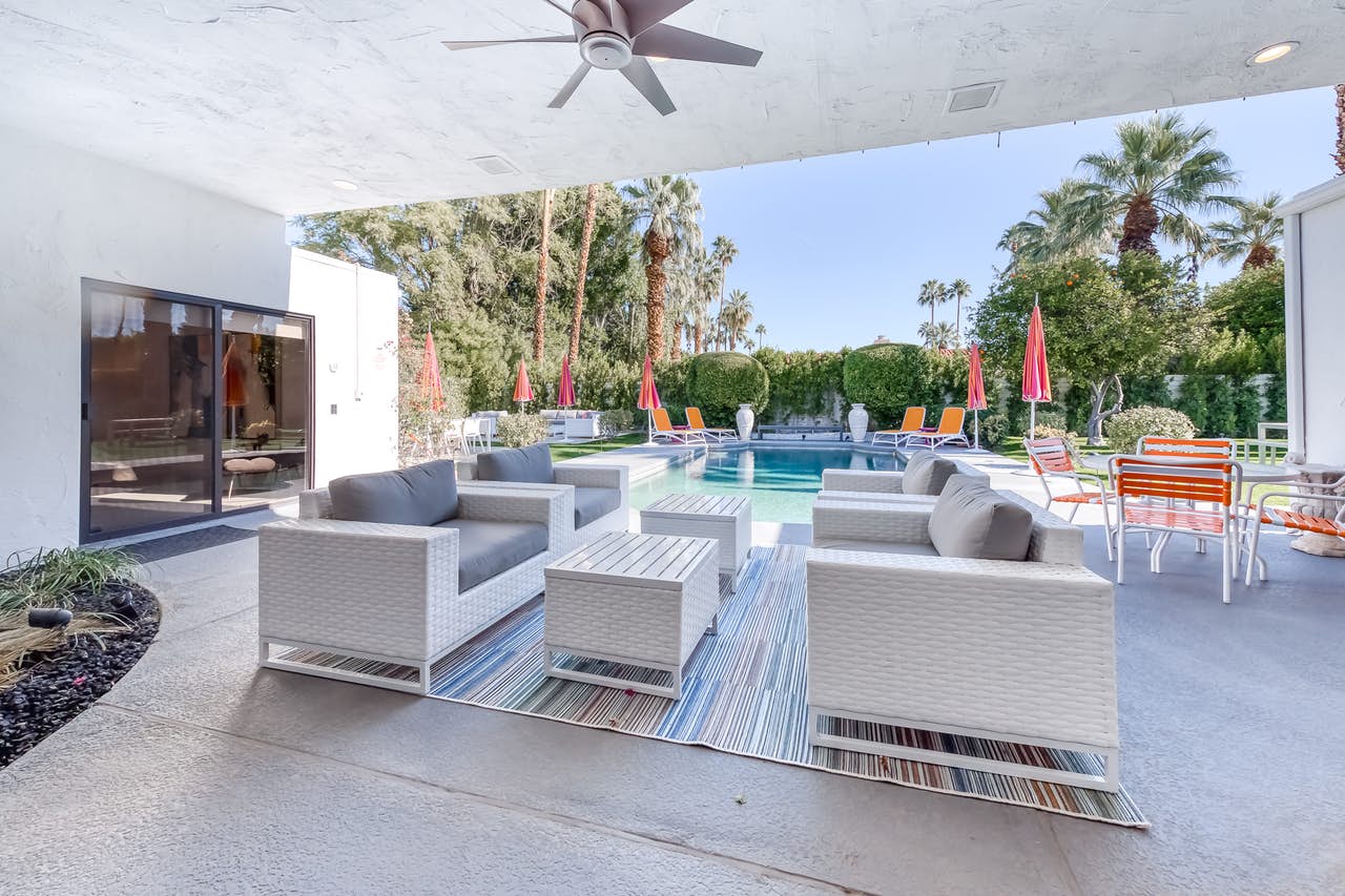 Modern outdoor furniture near an outdoor pool at a vacation home in Palm Springs, CA