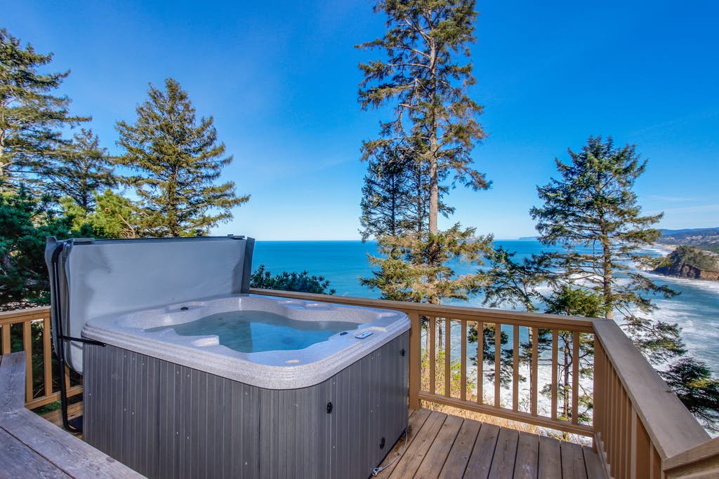 Outdoor hot tub on a deck of a vacation rental overlooking the ocean in Neskowin, OR.