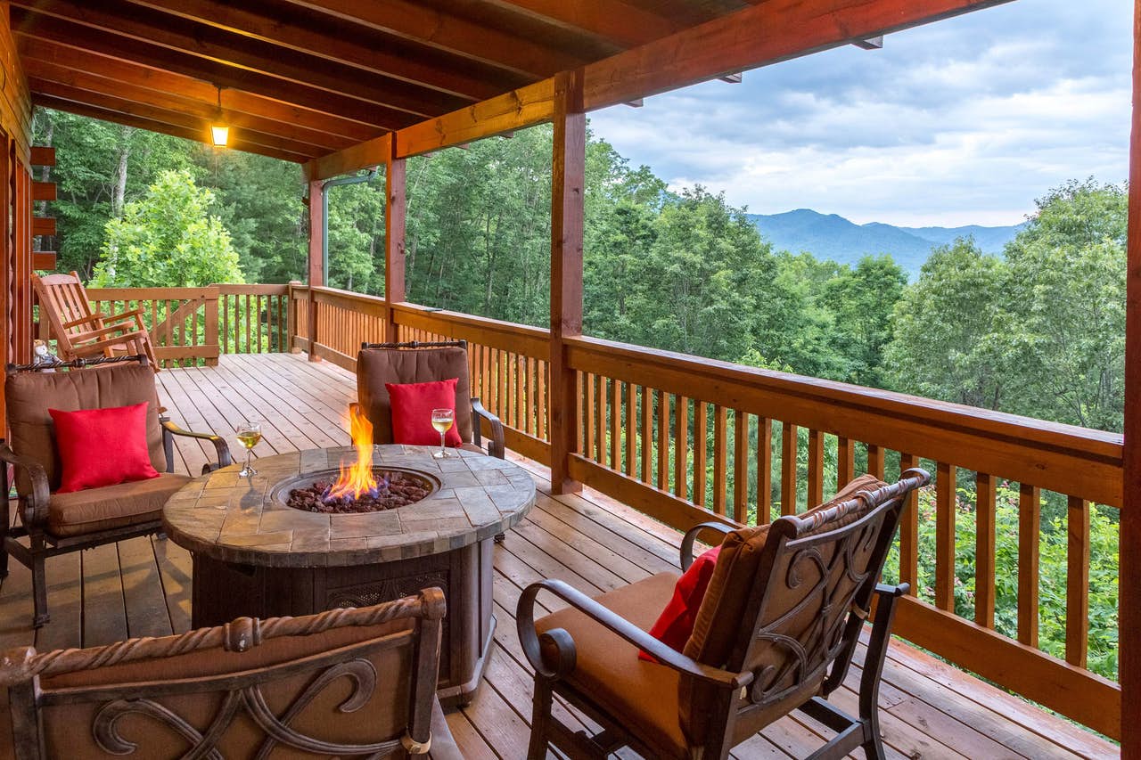 outdoor firepit on deck of Sylva, NC cabin with beautiful mountain views
