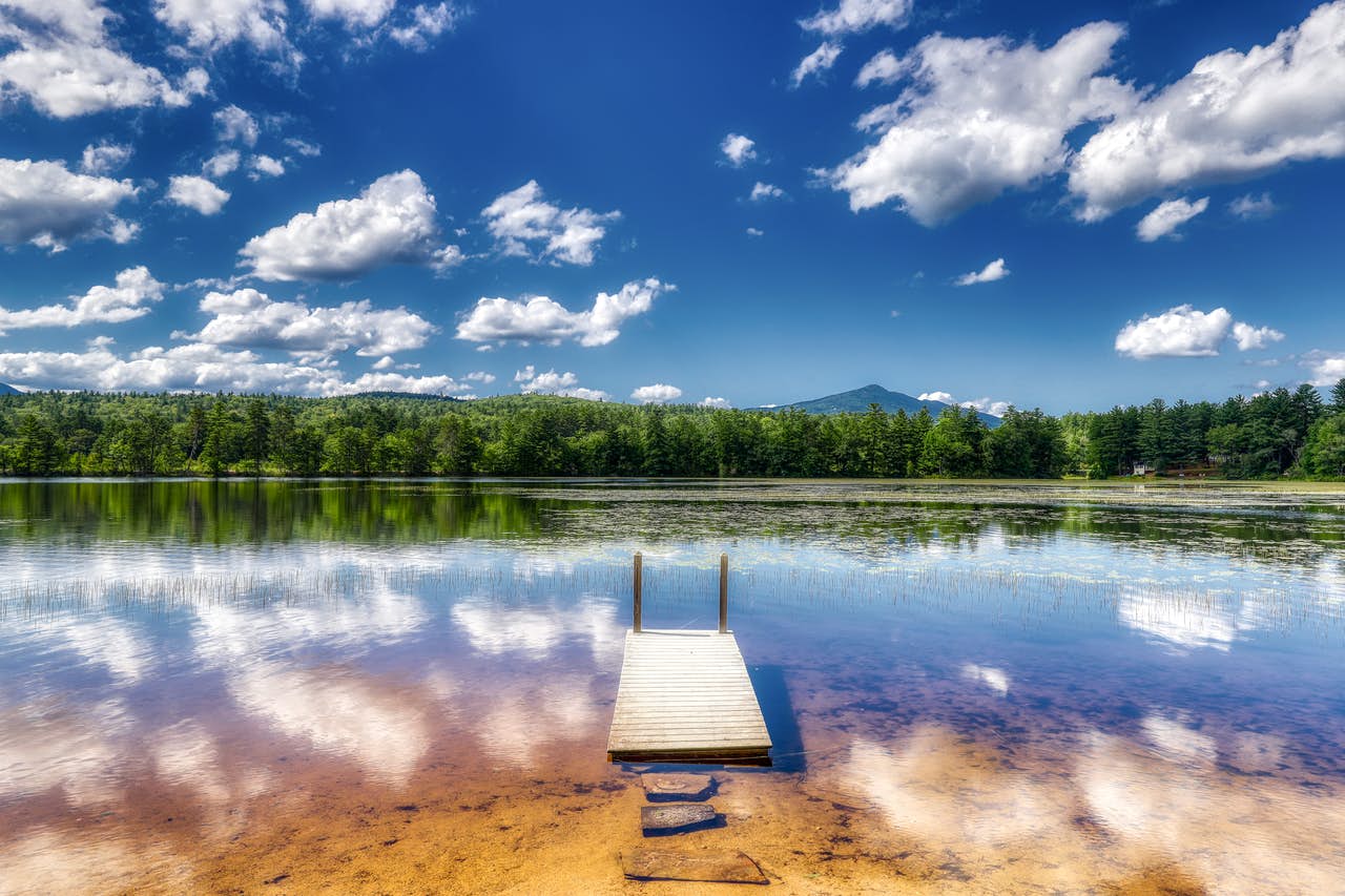 body of water in Conway, NH with dock