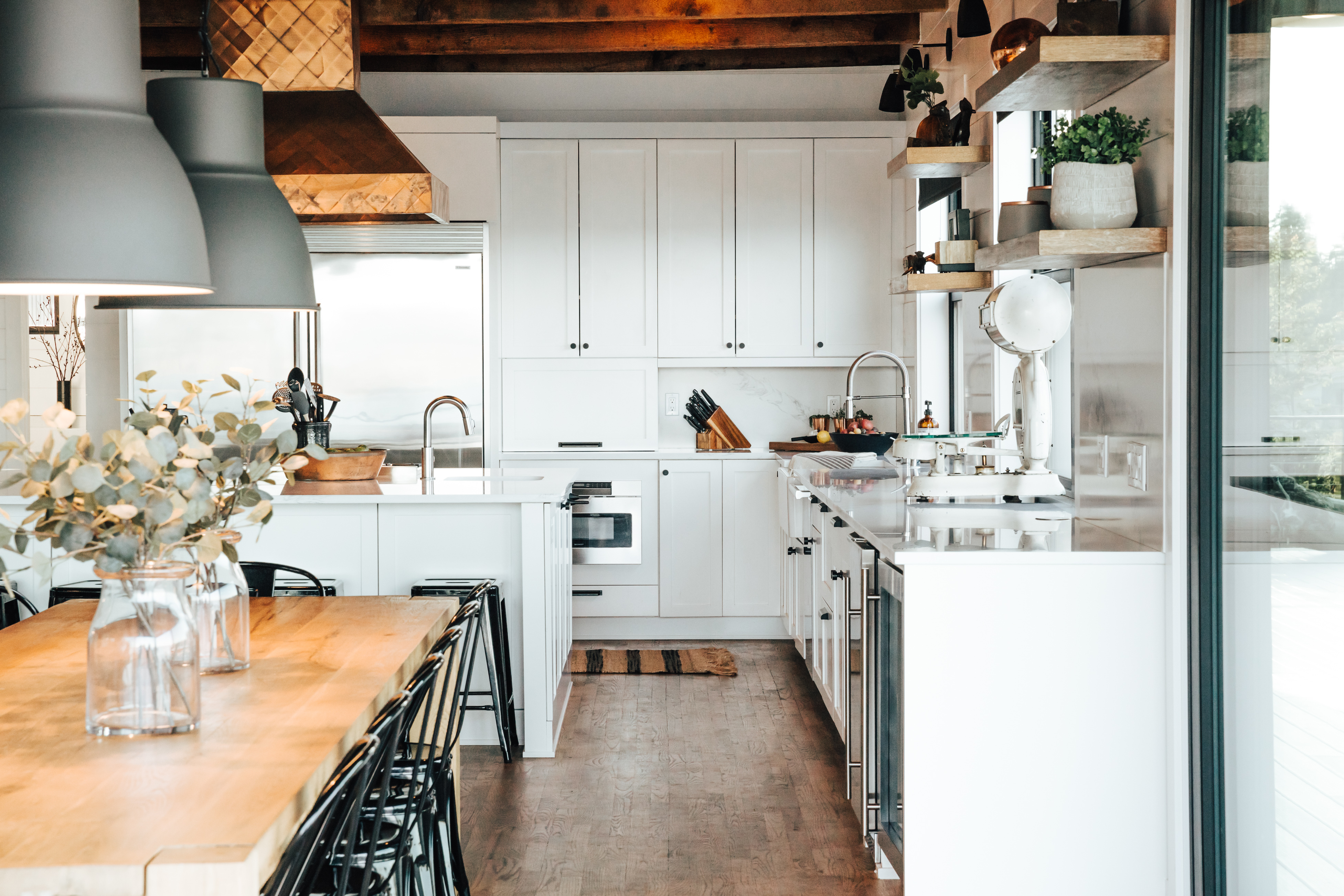 vacation rental kitchen on whidbey island with white cabinets and wood accents