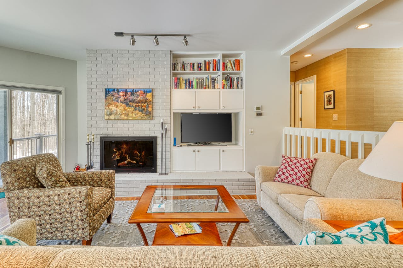 Adorable Michigan vacation rental with stone fireplace and cozy couches