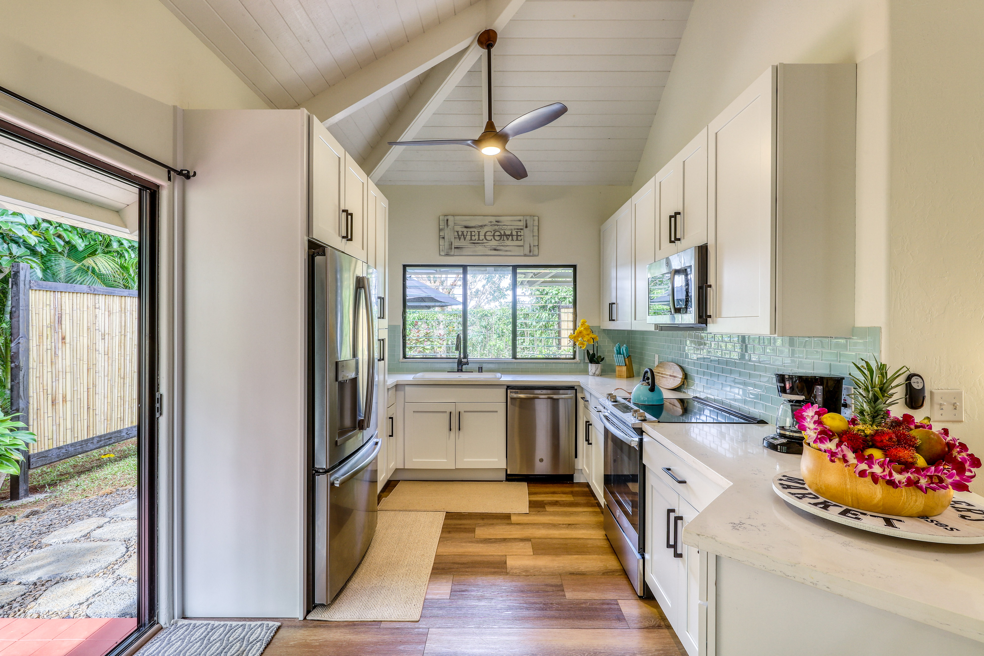 vacation rental kitchen with light blue backsplash in kauai, HI
