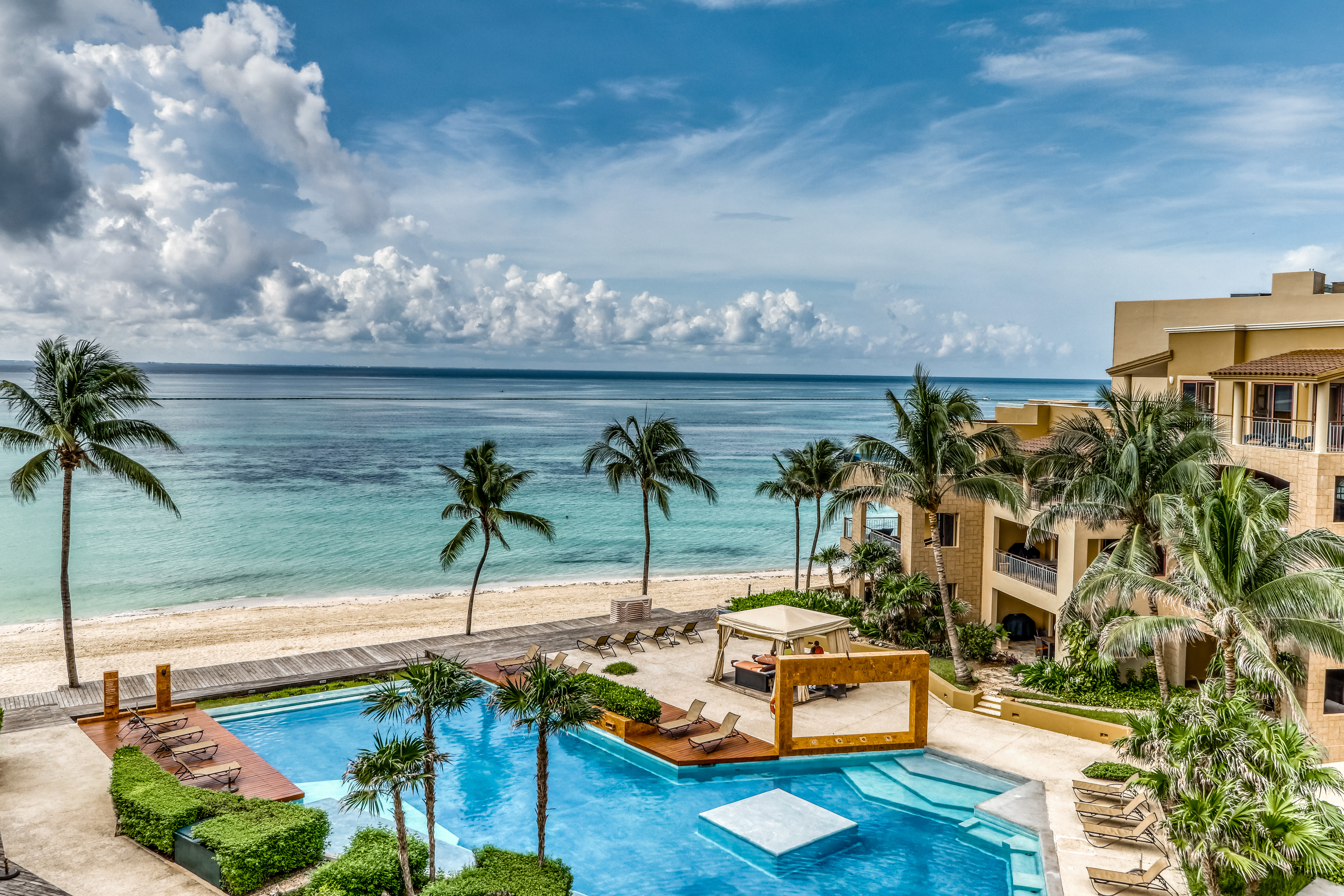 resort pool in playa del carmen with oceanfront views