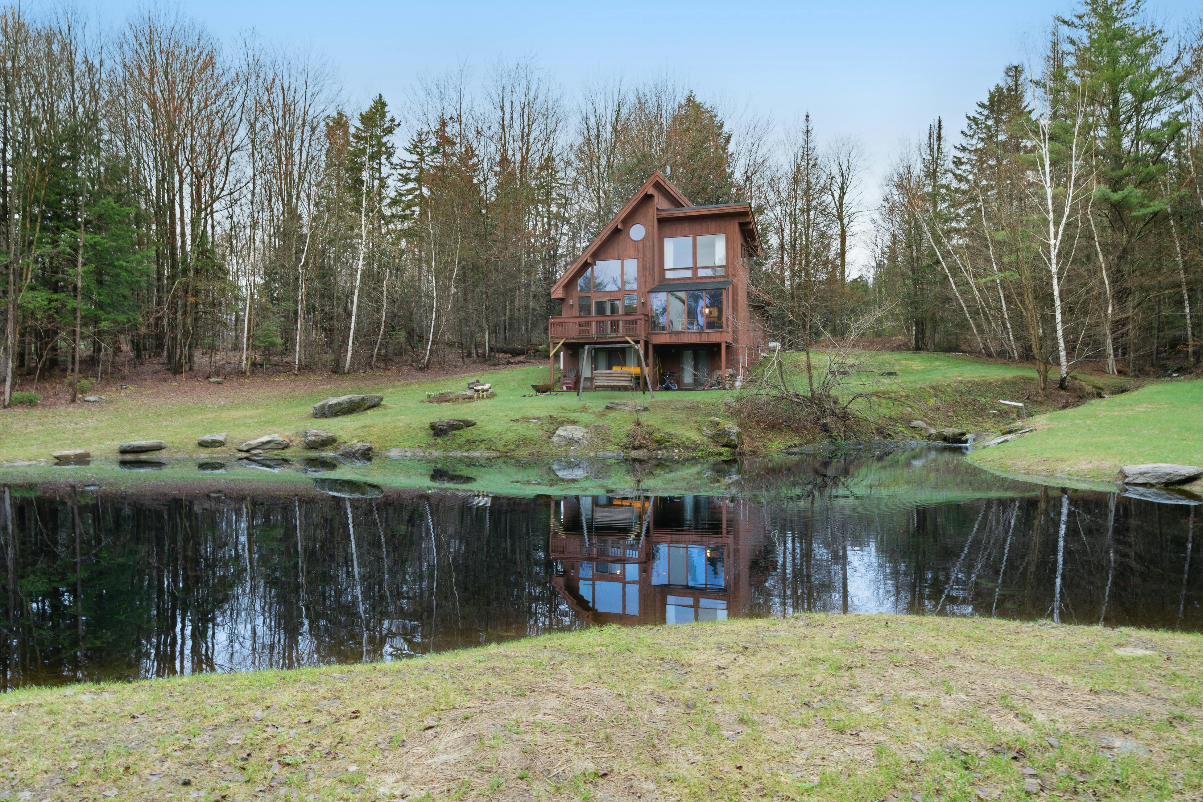 Vacation rental in Stowe, VT surrounded by woods and pond