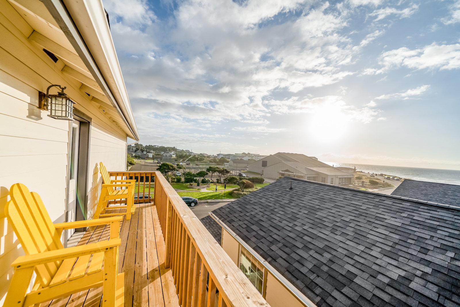 The back deck of a vacation rental overlooking the ocean in Newport, OR.