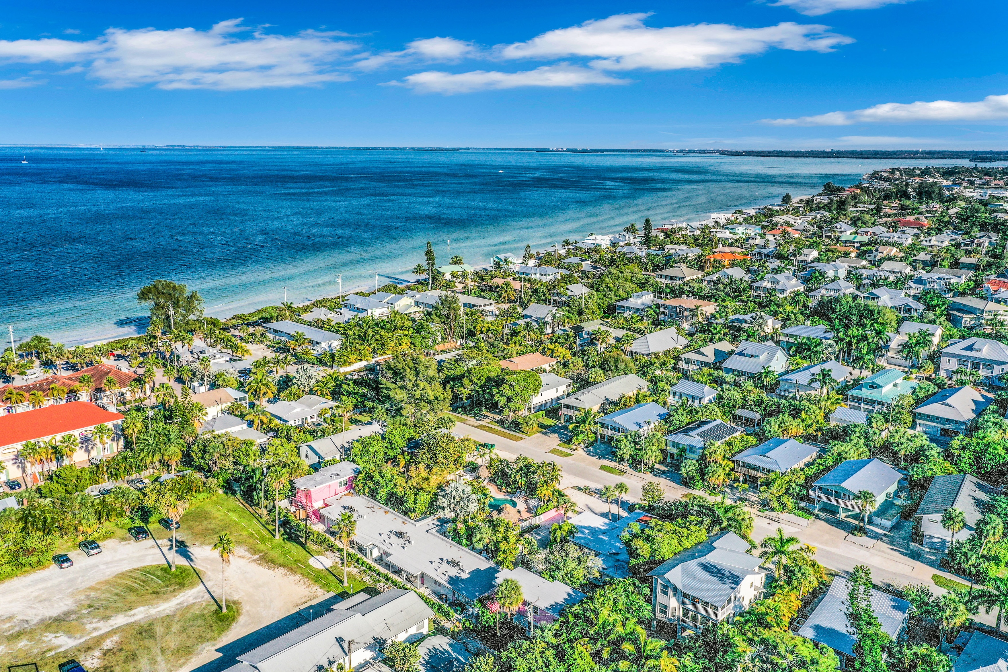 beach homes and vacation rentals hug the coast of anna maria island