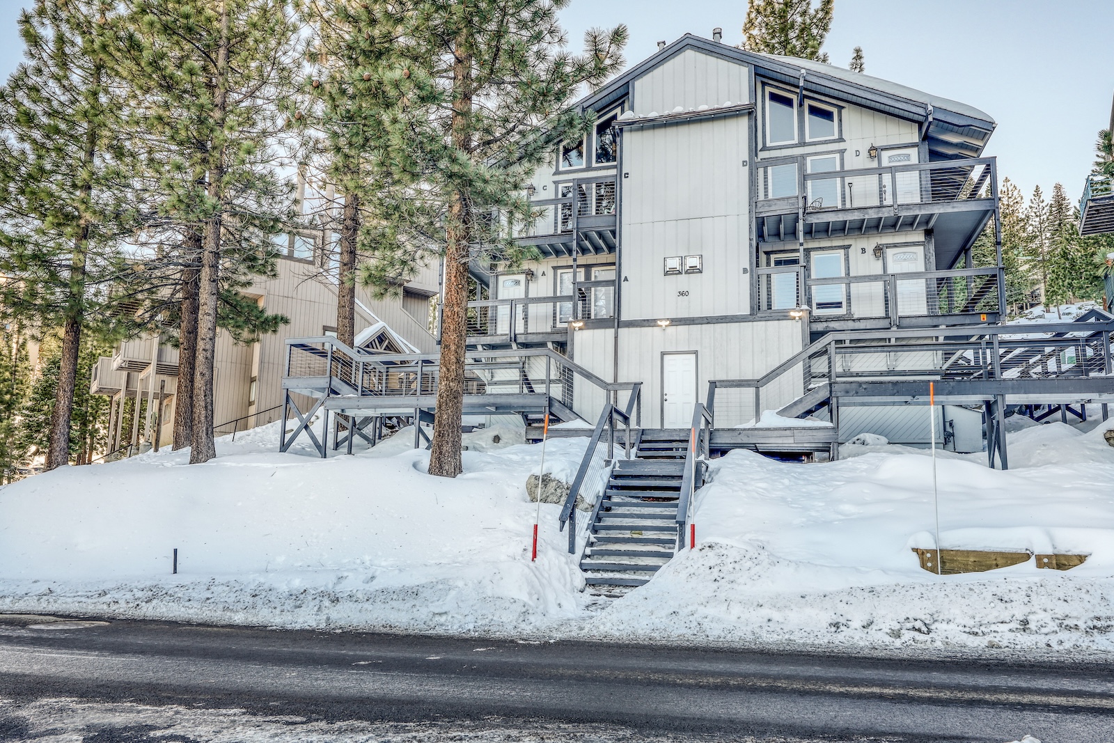 The exterior of a ski-in/ski-out rental in Stateline, NV covered in snow.