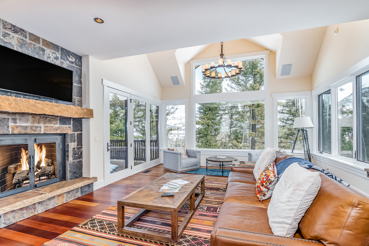 The living room with high ceilings and elegant design at a vacation rental in Mountain Village, CO.