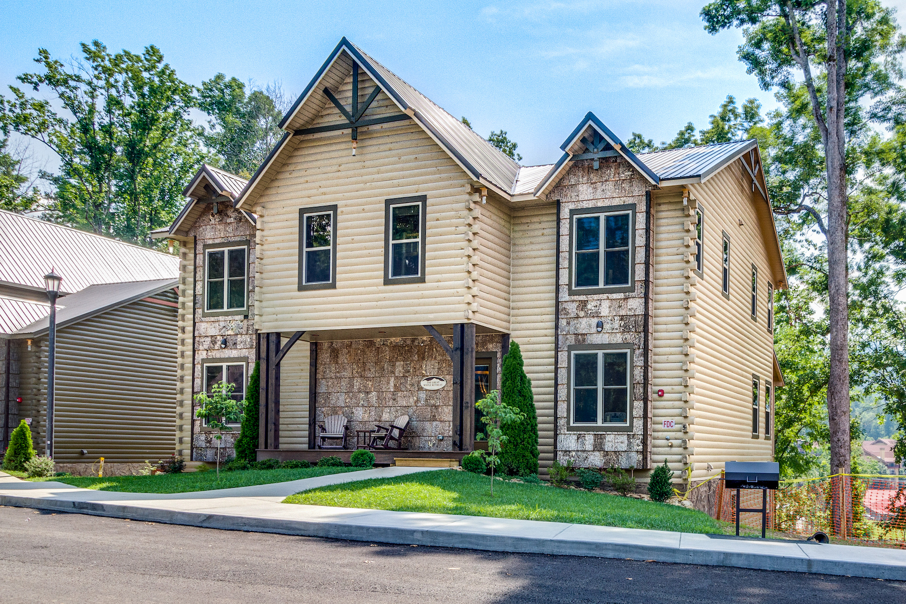 A large home with log cabin features and an elegant exterior that's a vacation rental in Gatlinburg, Tennessee.