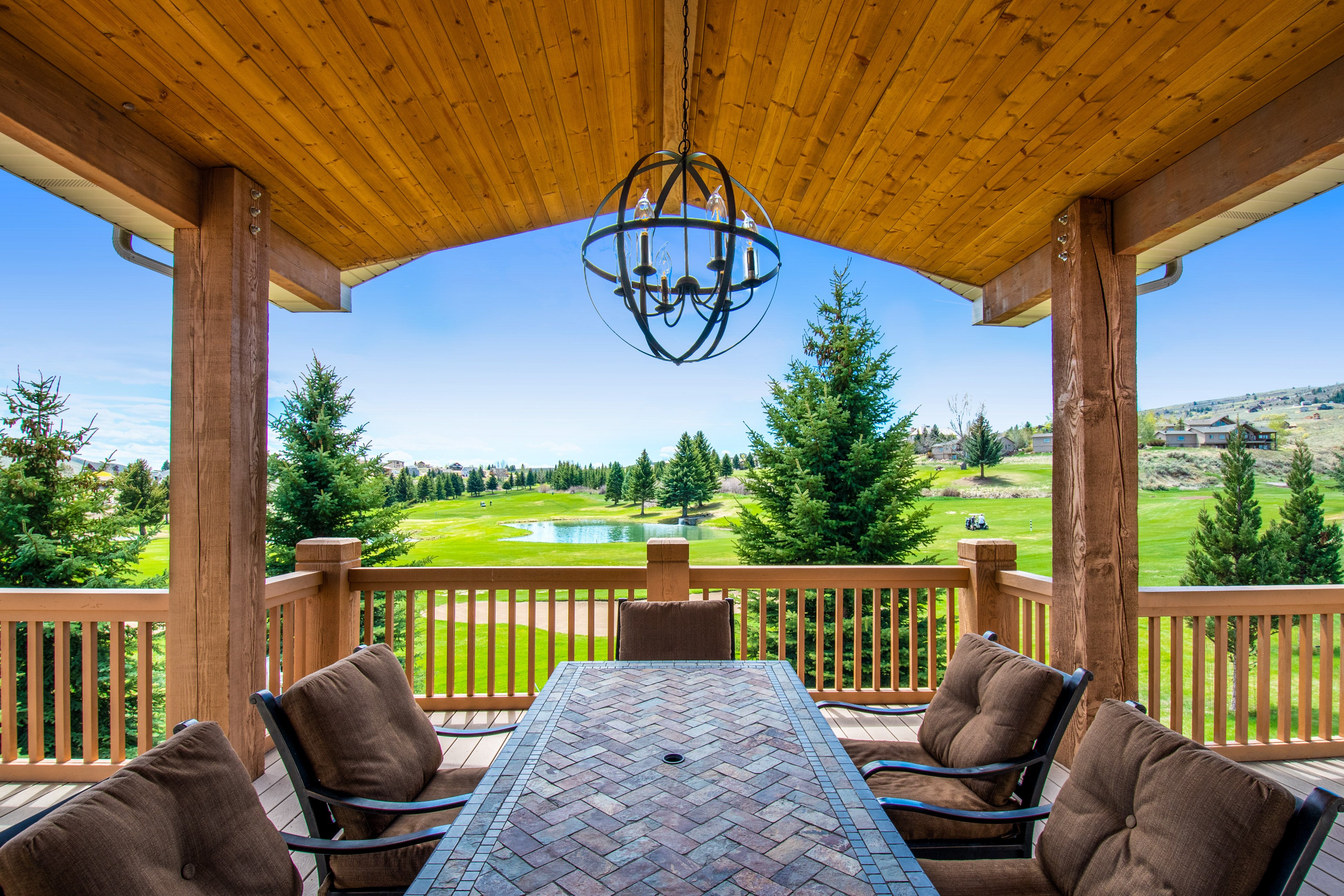 covered patio with outdoor table facing golf course in bear lake, utah