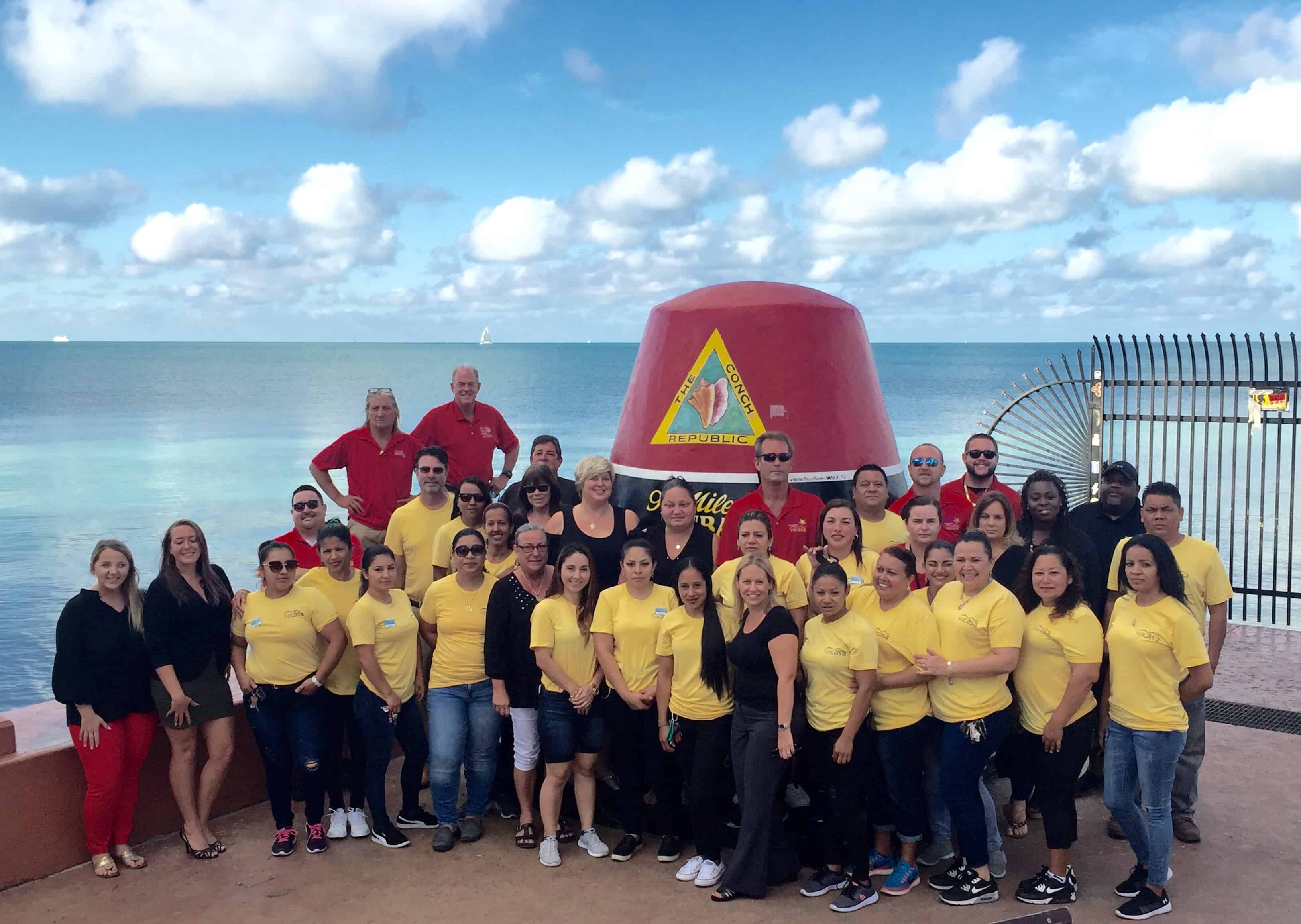 The Vacasa team taking a group photo in Key West, FL