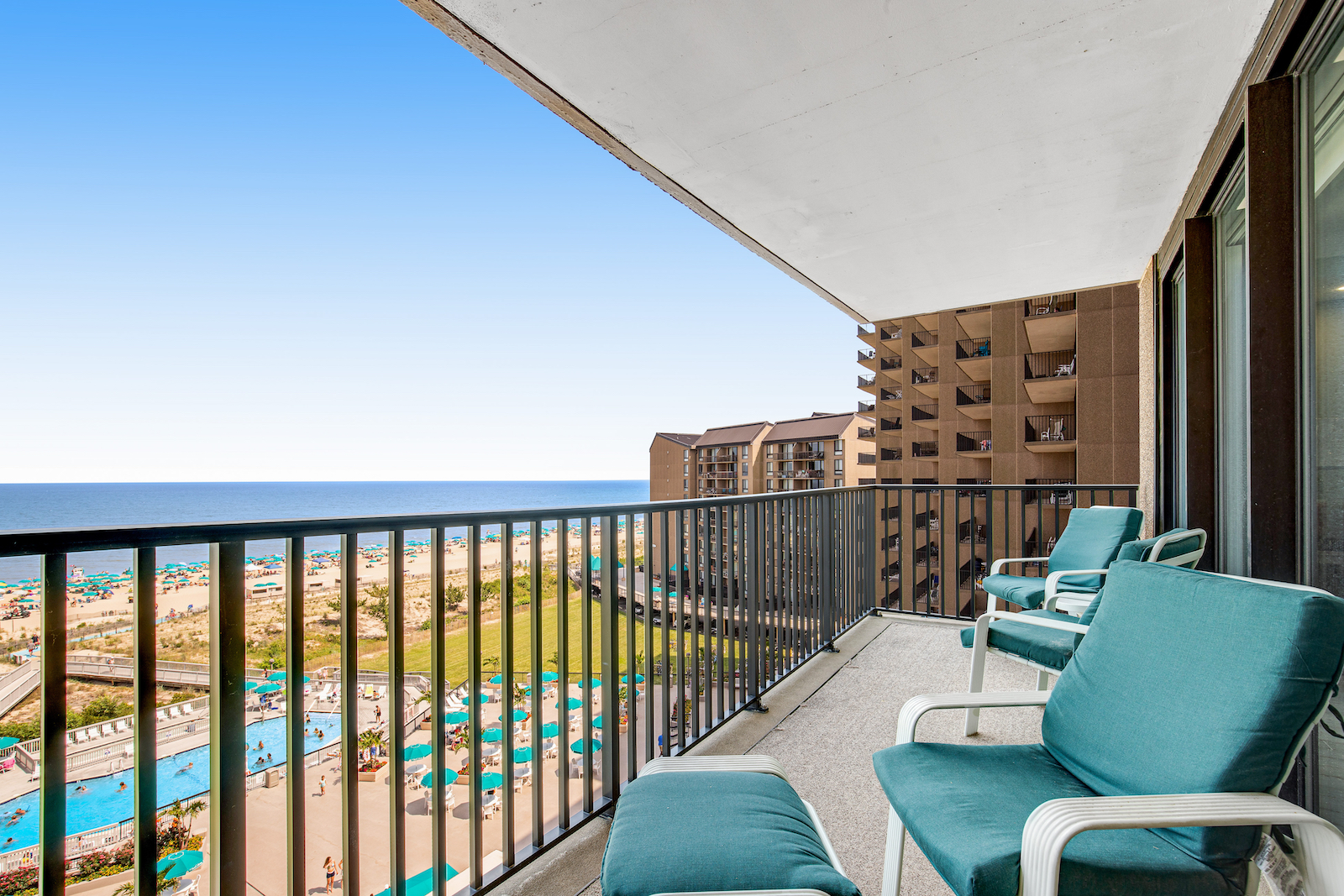 The view from a deck overlooking the pool and ocean at a vacation rental condo at the Sea Colony in Bethany Beach.