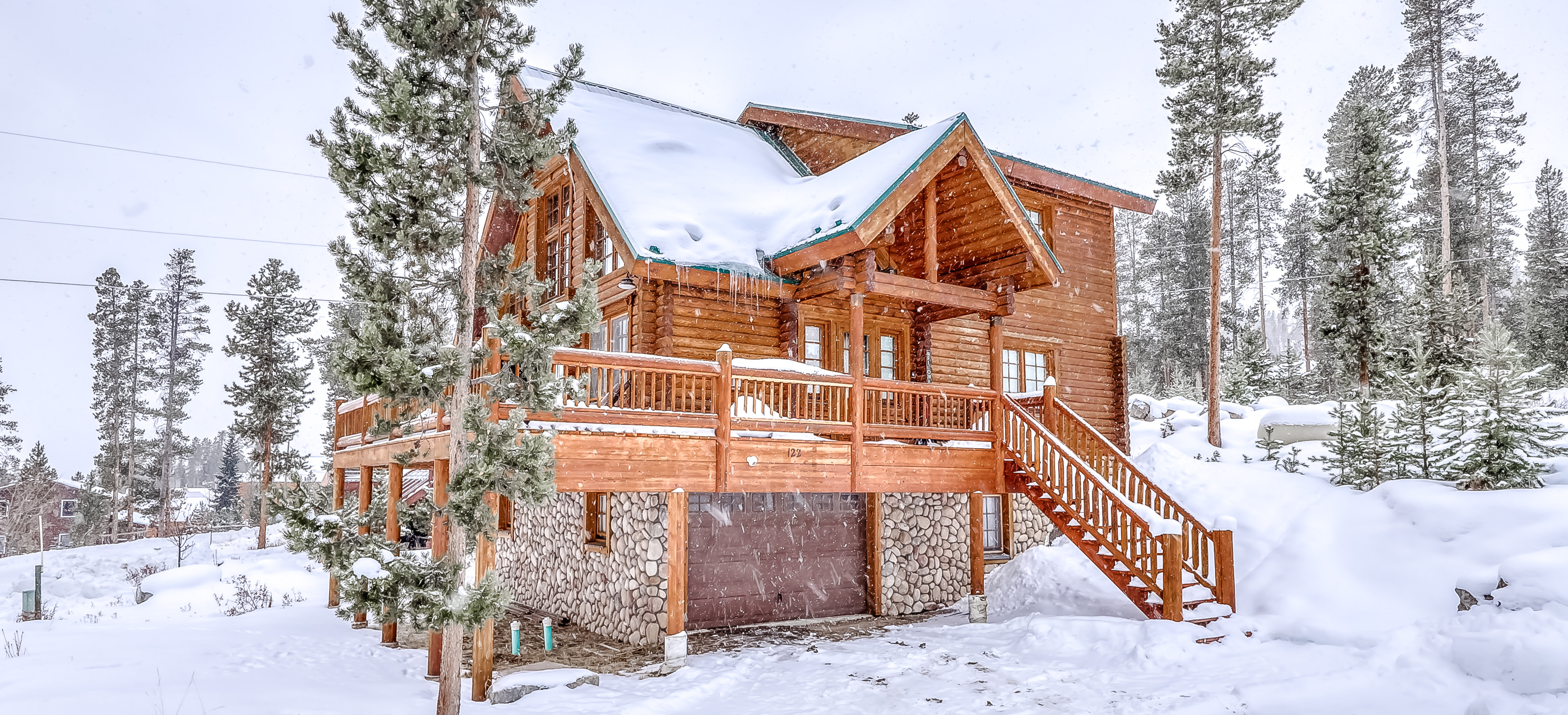 cabin in grand lake, co surrounded by snow