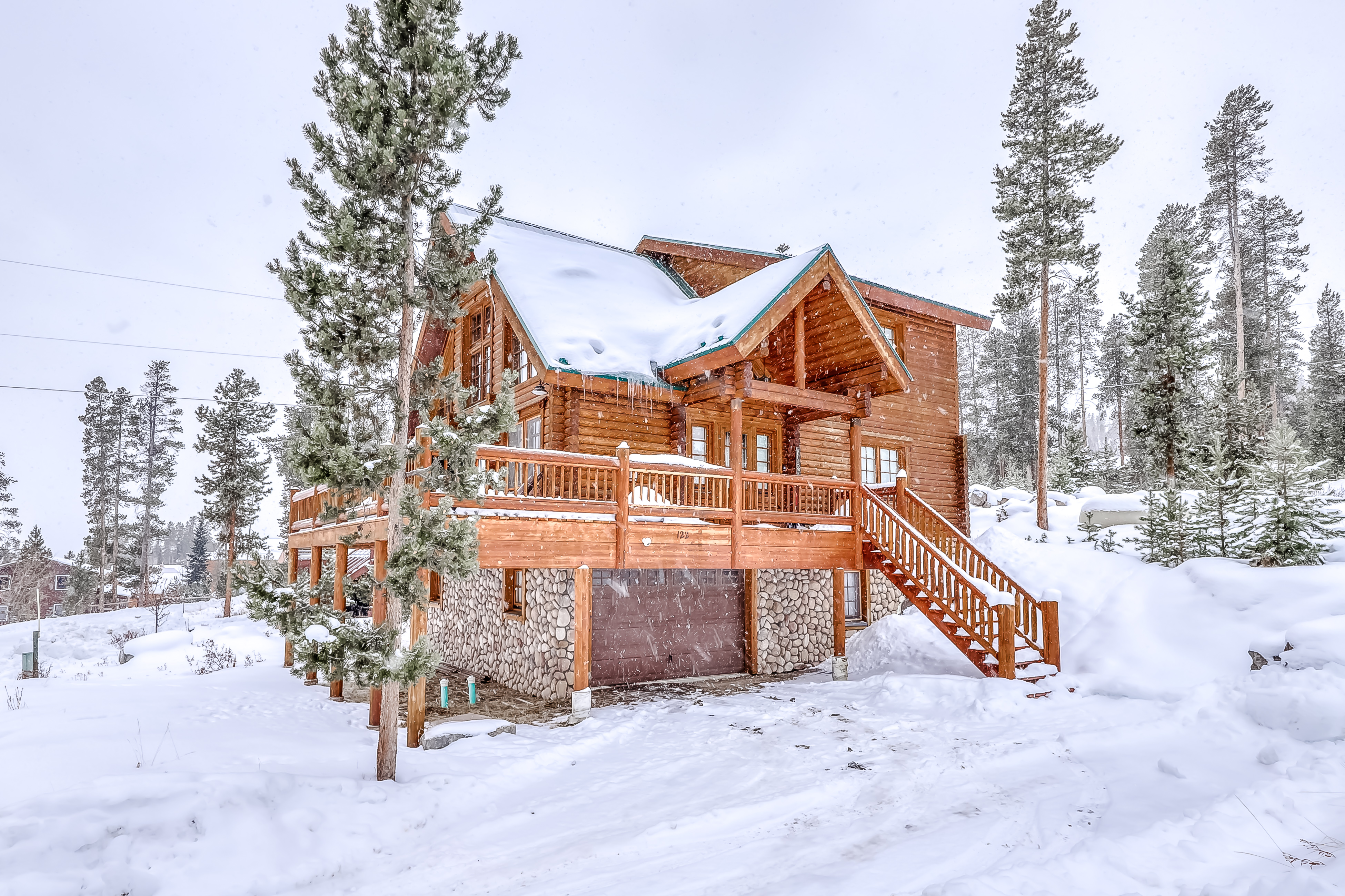 cabin in grand lake, co surrounded by snow