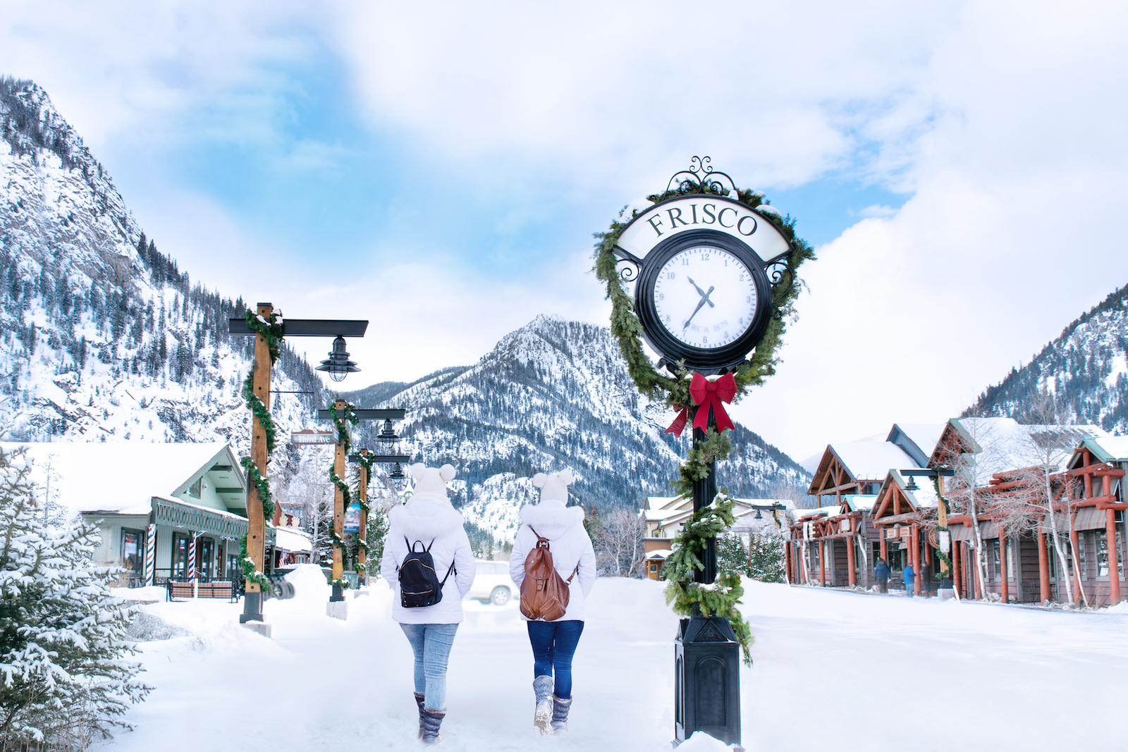 Frisco Colorado in the winter with two folks walking in the snow.