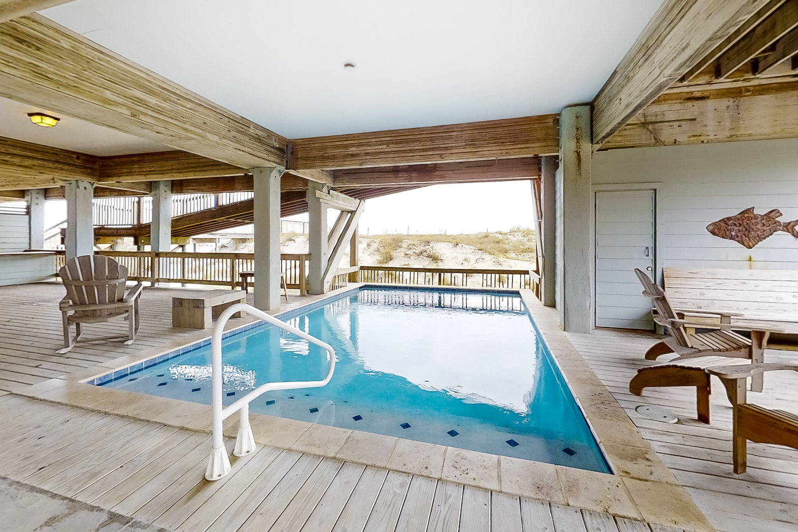 The pool of a vacation rental under the home at a vacation rental in Gulf Shores, AL.
