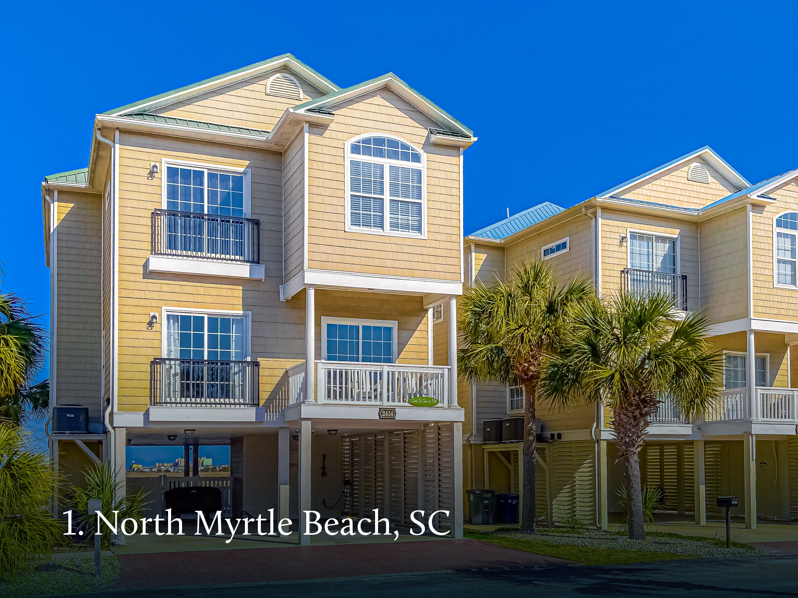 Yellow vacation home with stilt style foundation