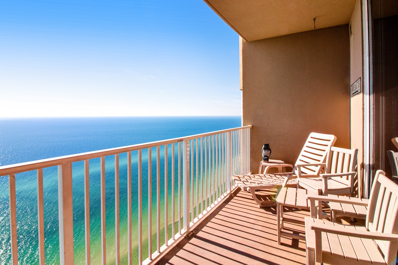The deck of a vacation rental condo overlooking the beach in Panama City Beach, Florida at Tidewater Beach Resort.