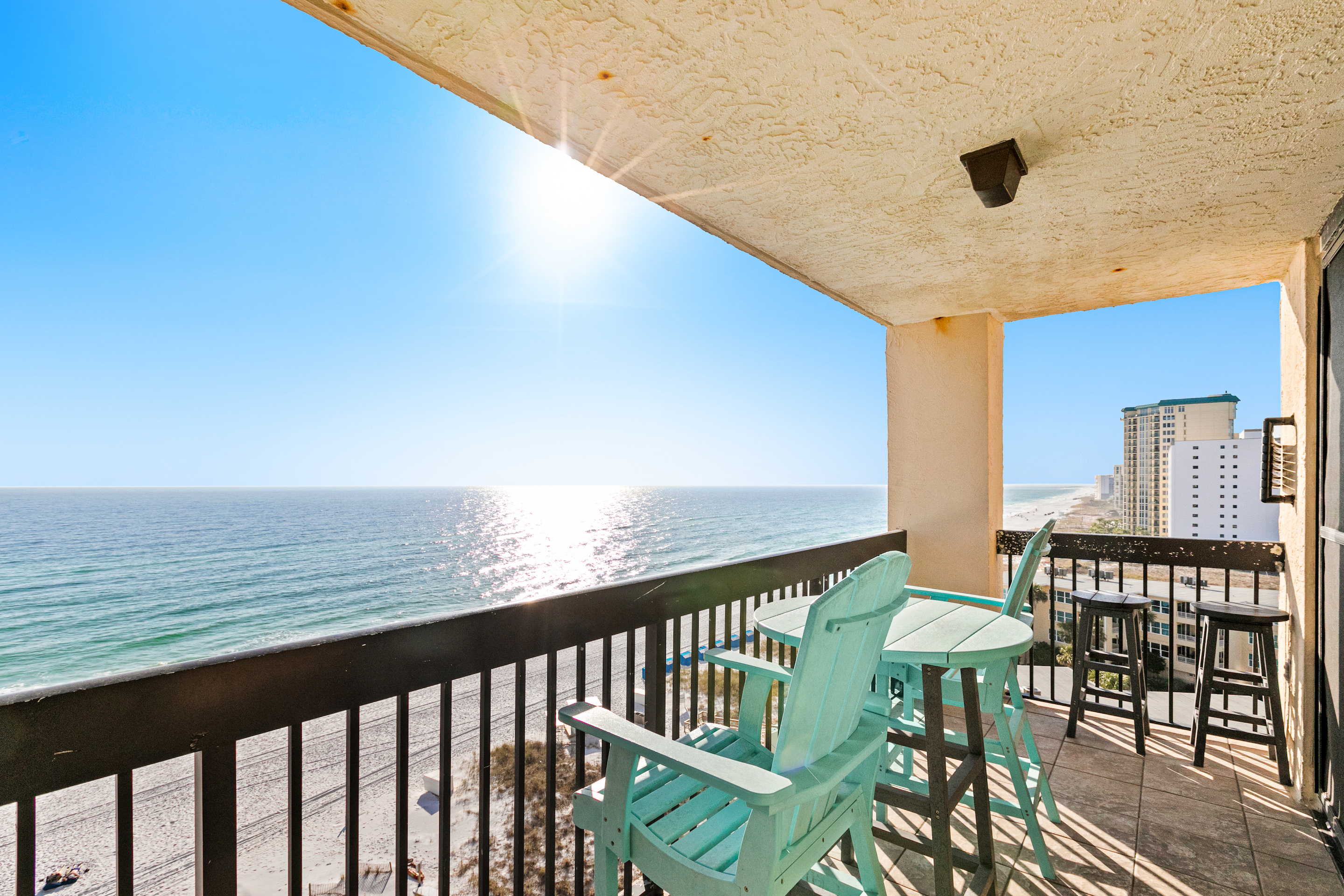Outdoor furniture sits on balcony of resort facing the Gulf waters in Destin, FL