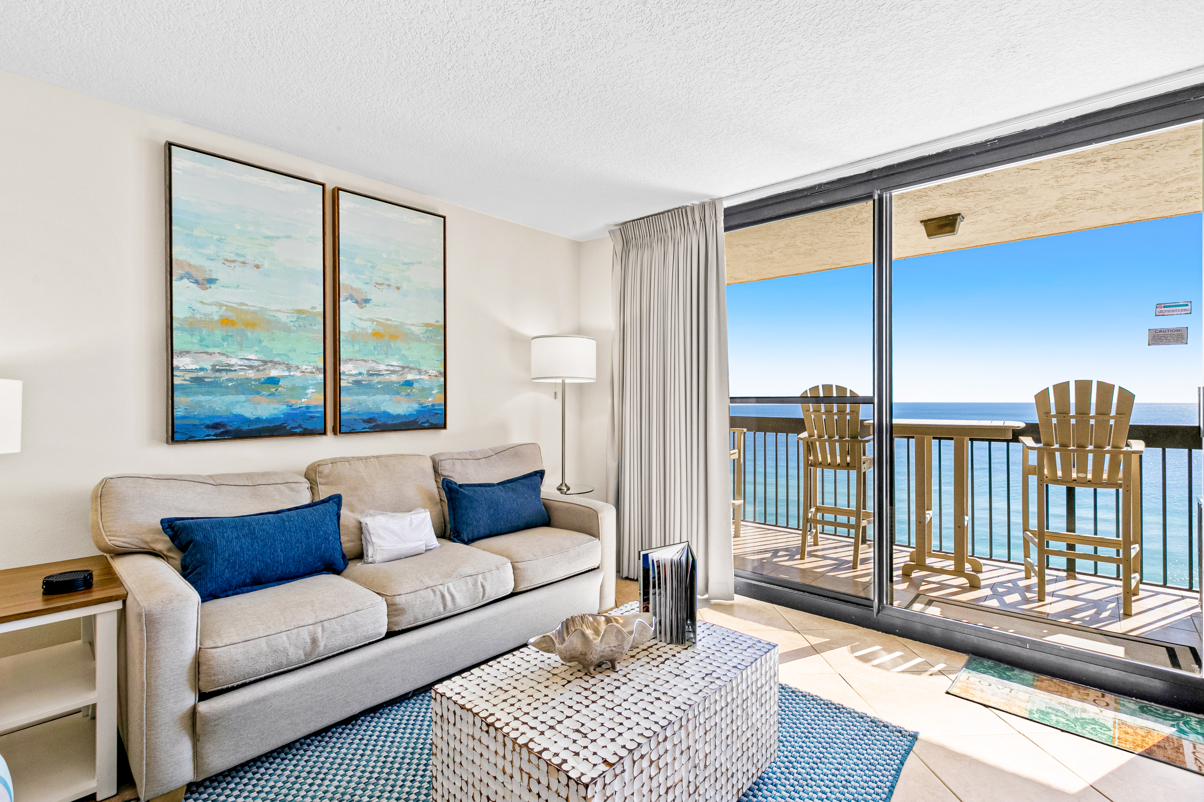 living space inside Sundestin resort with balcony facing the ocean