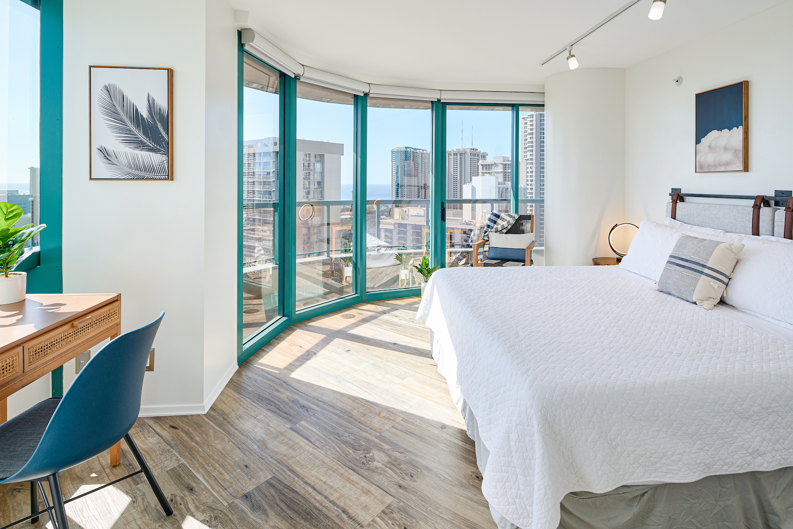 A bedroom with a view at a long-term rental in Honolulu, HI.