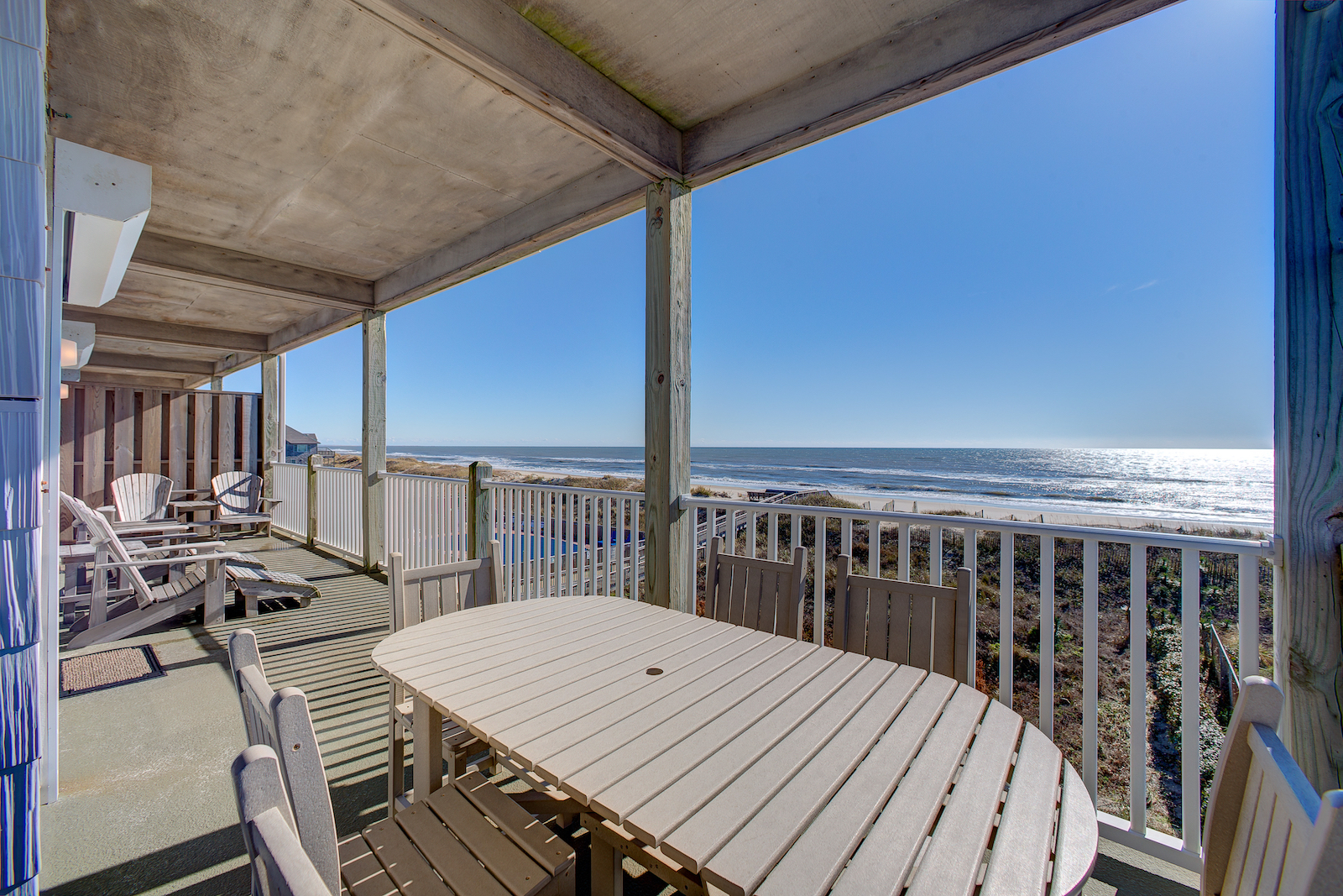 The deck with a beachfront view at a vacation rental in Hatteras, NC.
