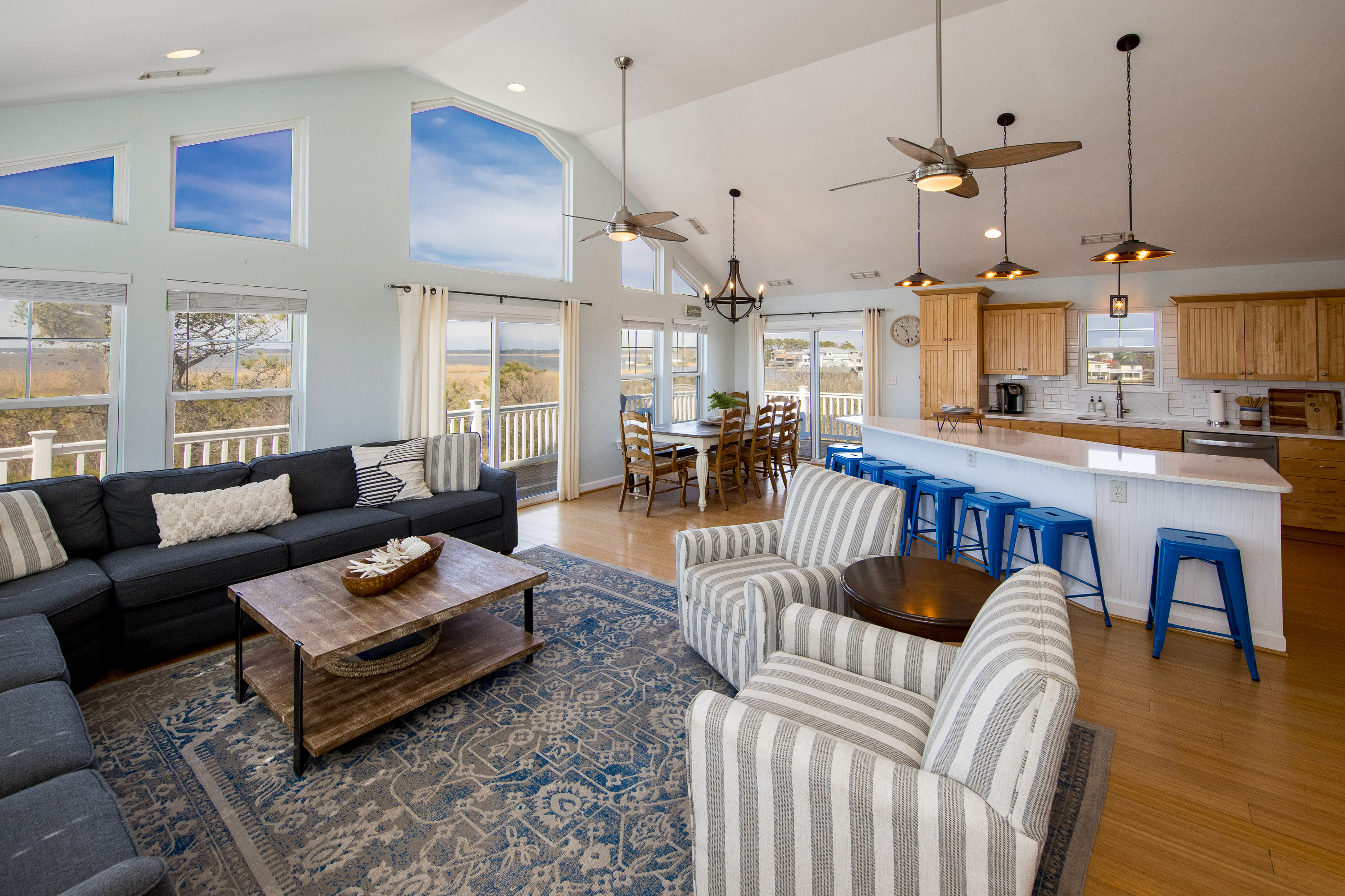 interior of Virginia Beach house showcasing beach views, blue accents, and cozy furniture