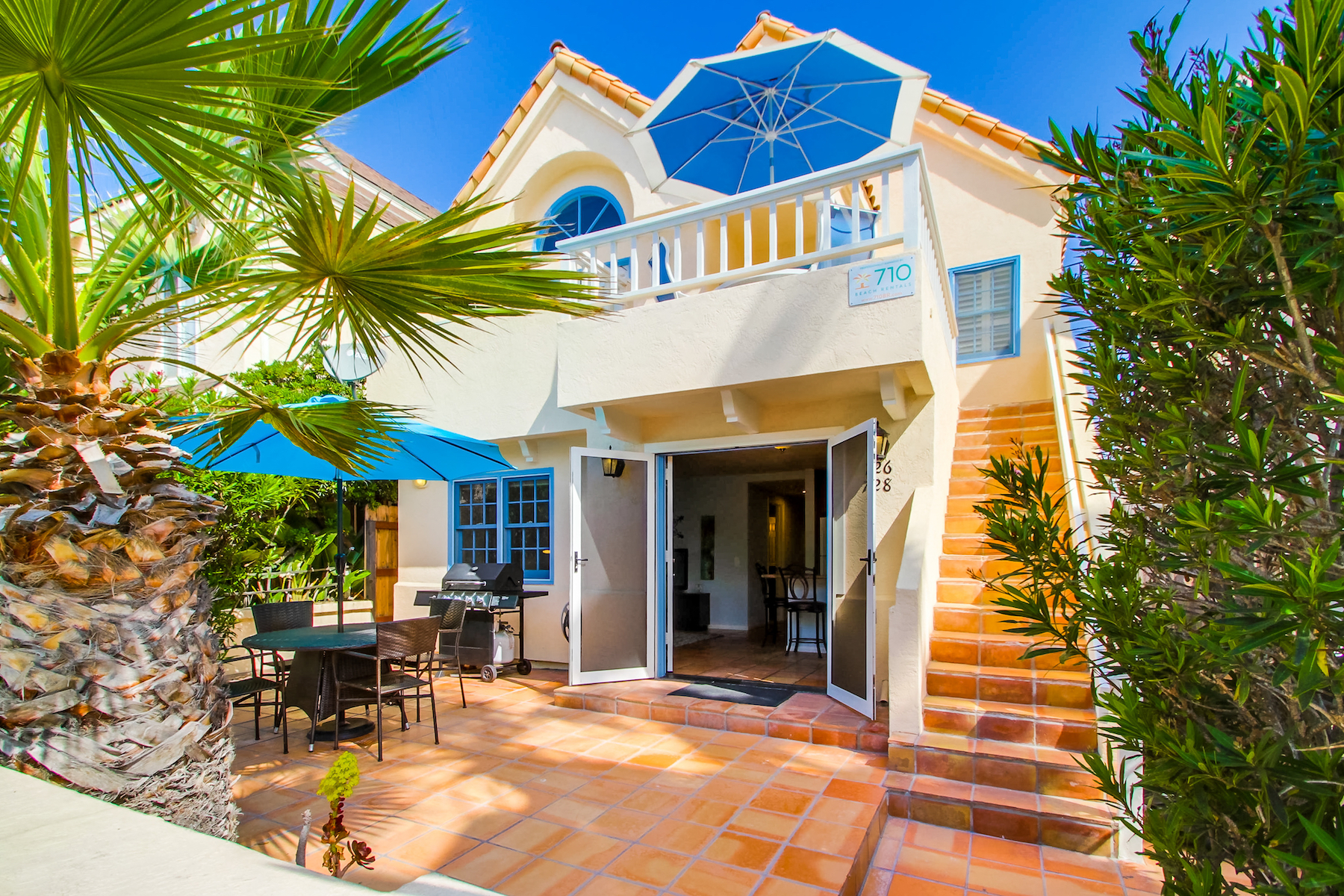 The front of a vacation rental in San Diego, CA with Spanish style architecture.