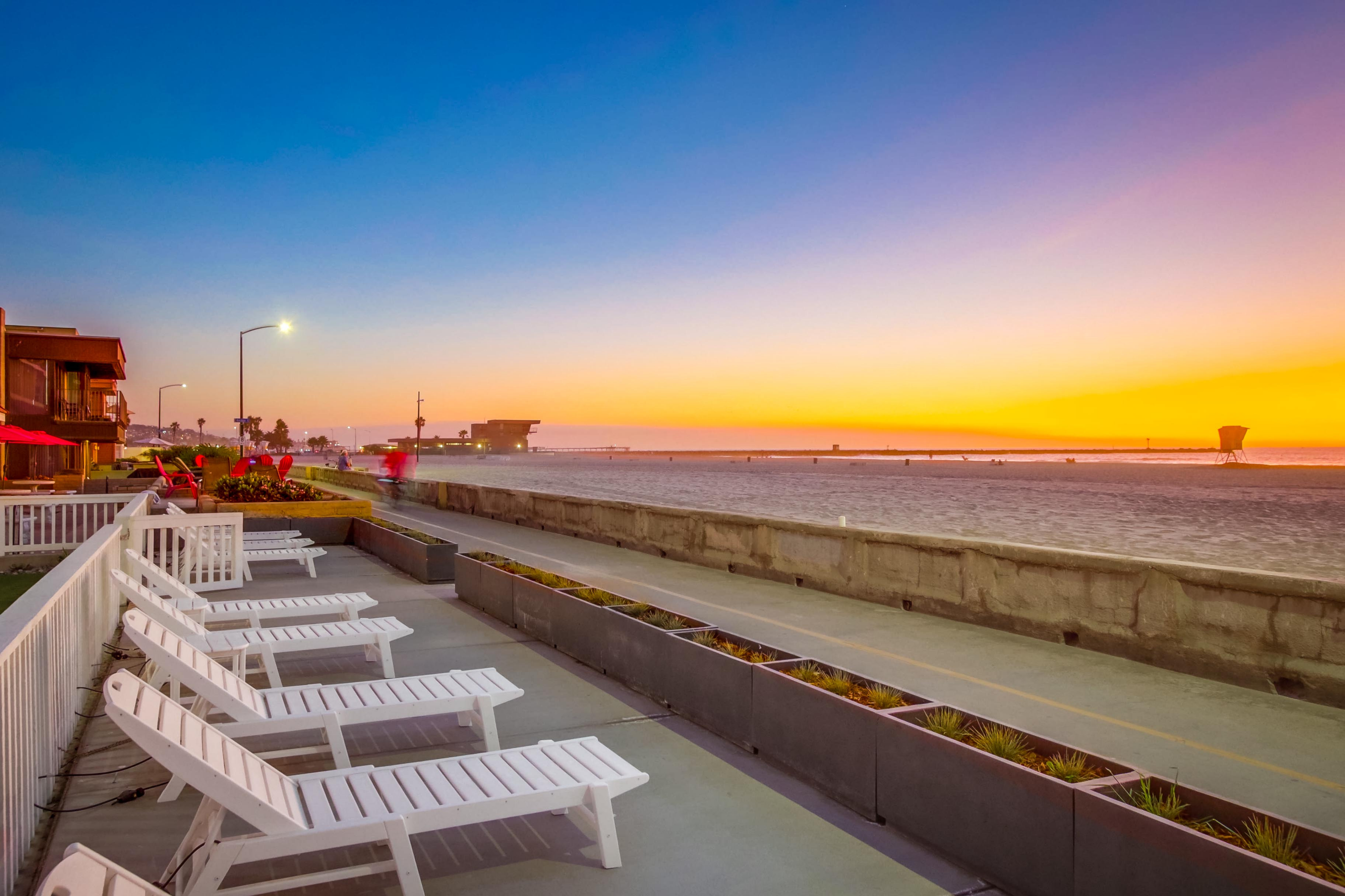 Chairs along the boardwalk on the coast of San Diego.