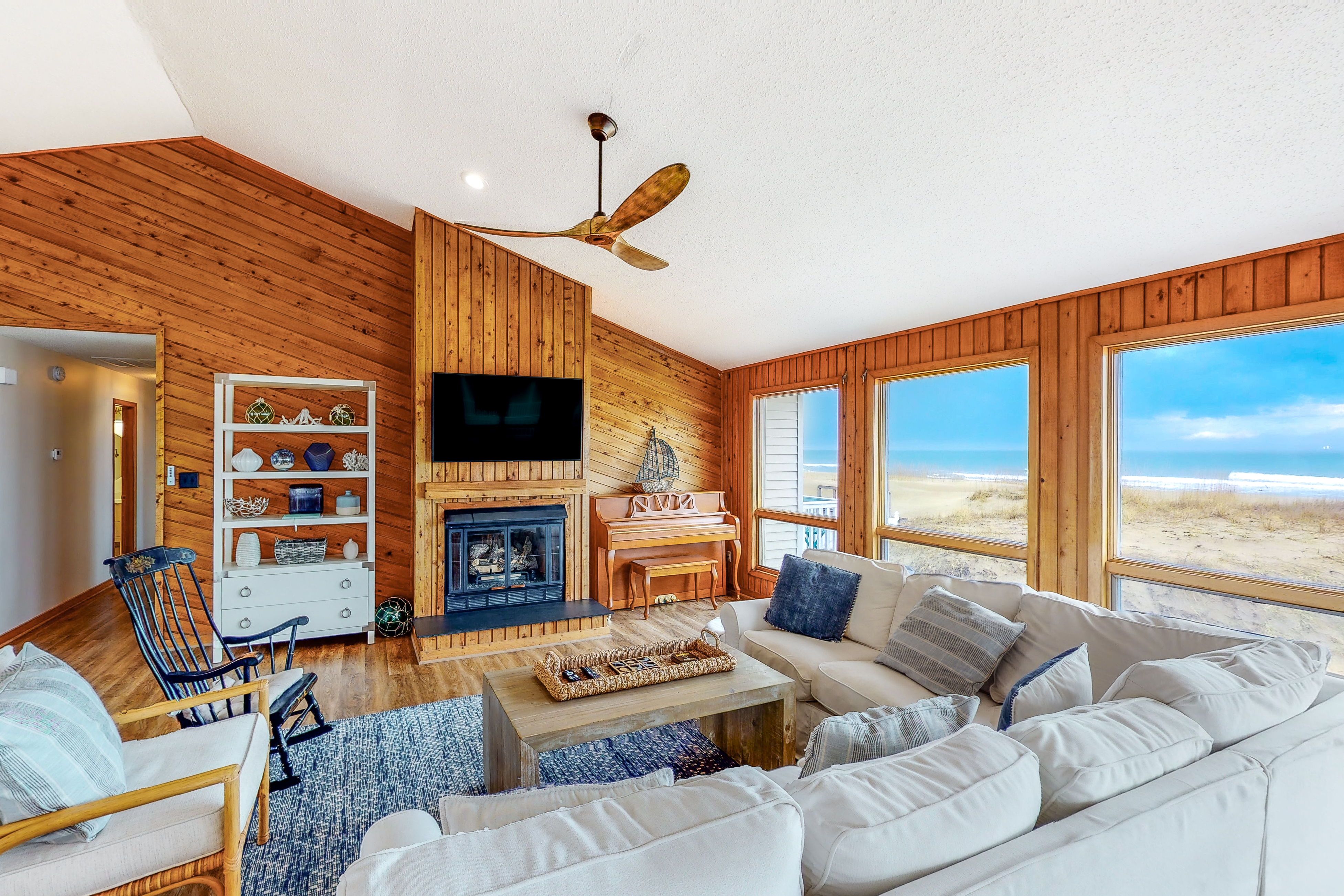 open living room with large windows overlooking the beach in Virginia Beach