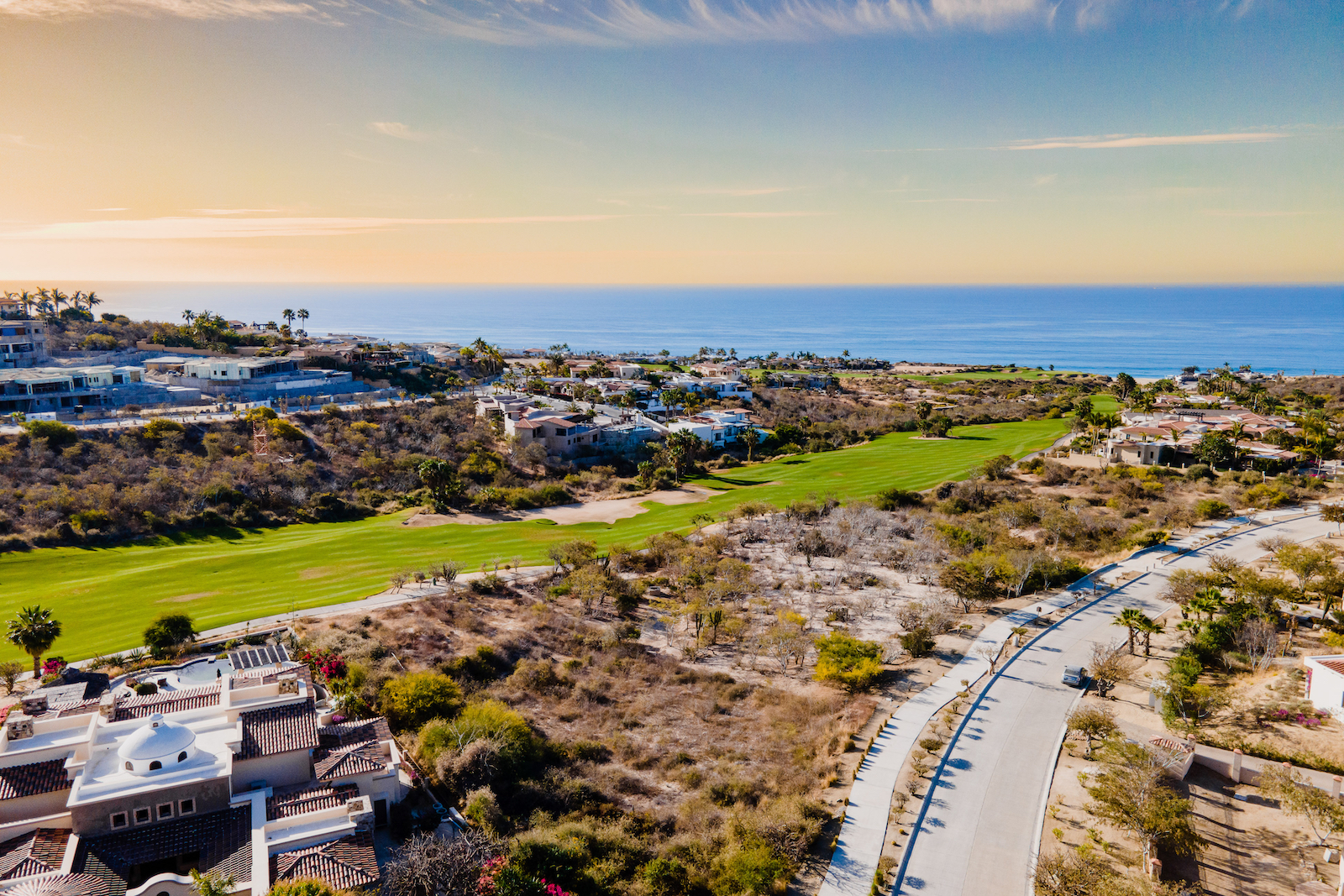 Drone shot of the ocean and a golf course in Baja, Mexico.