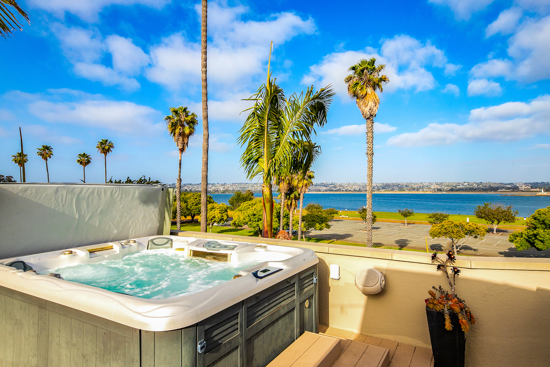 A vacation rental in San Diego, CA with a hot tub overlooking the bay.